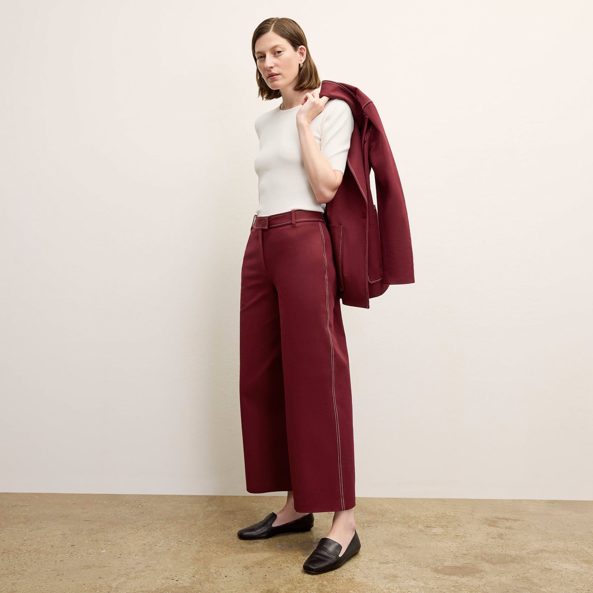 front image of a woman wearing the abby pant in berry jam 