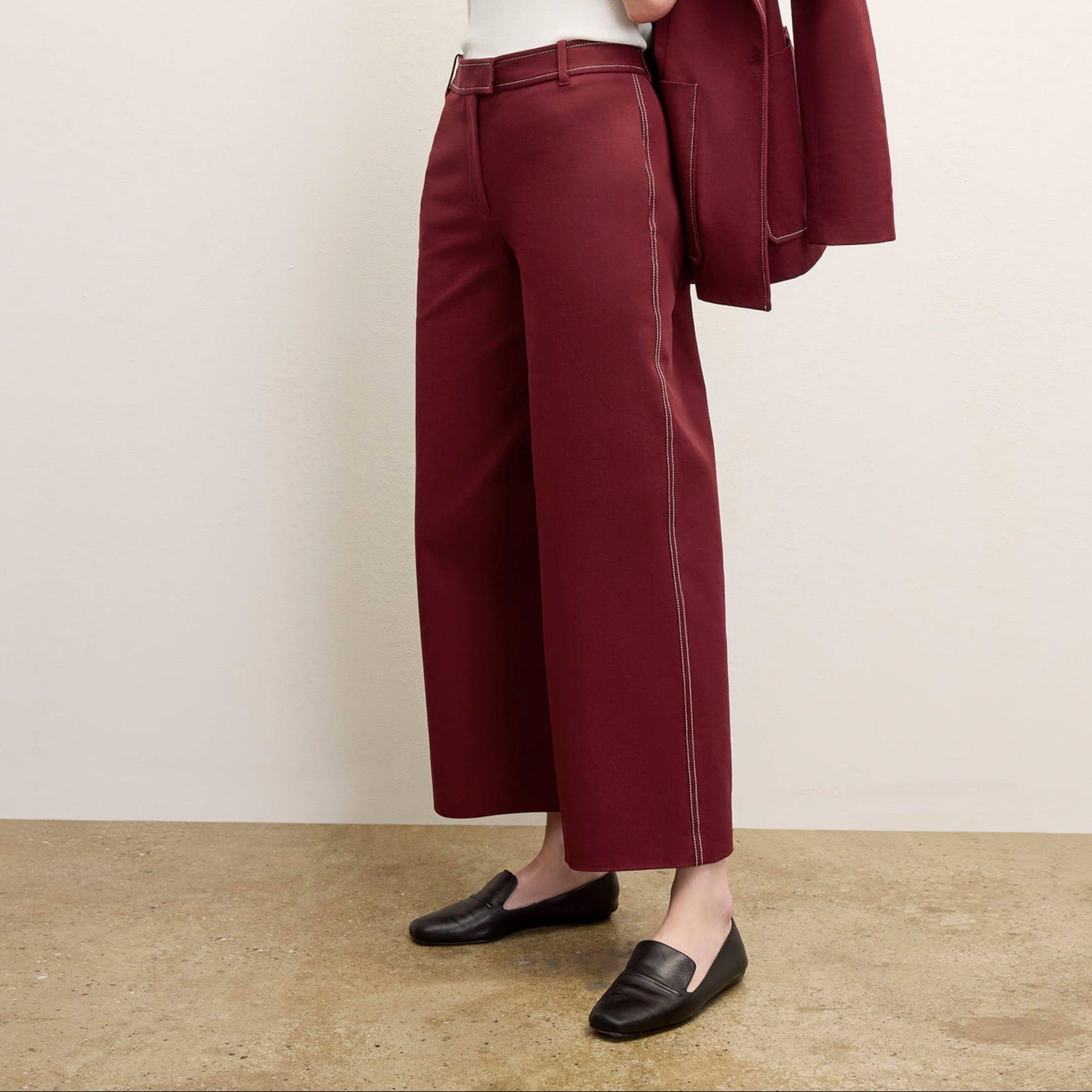 front image of a woman wearing the abby pant in berry jam 