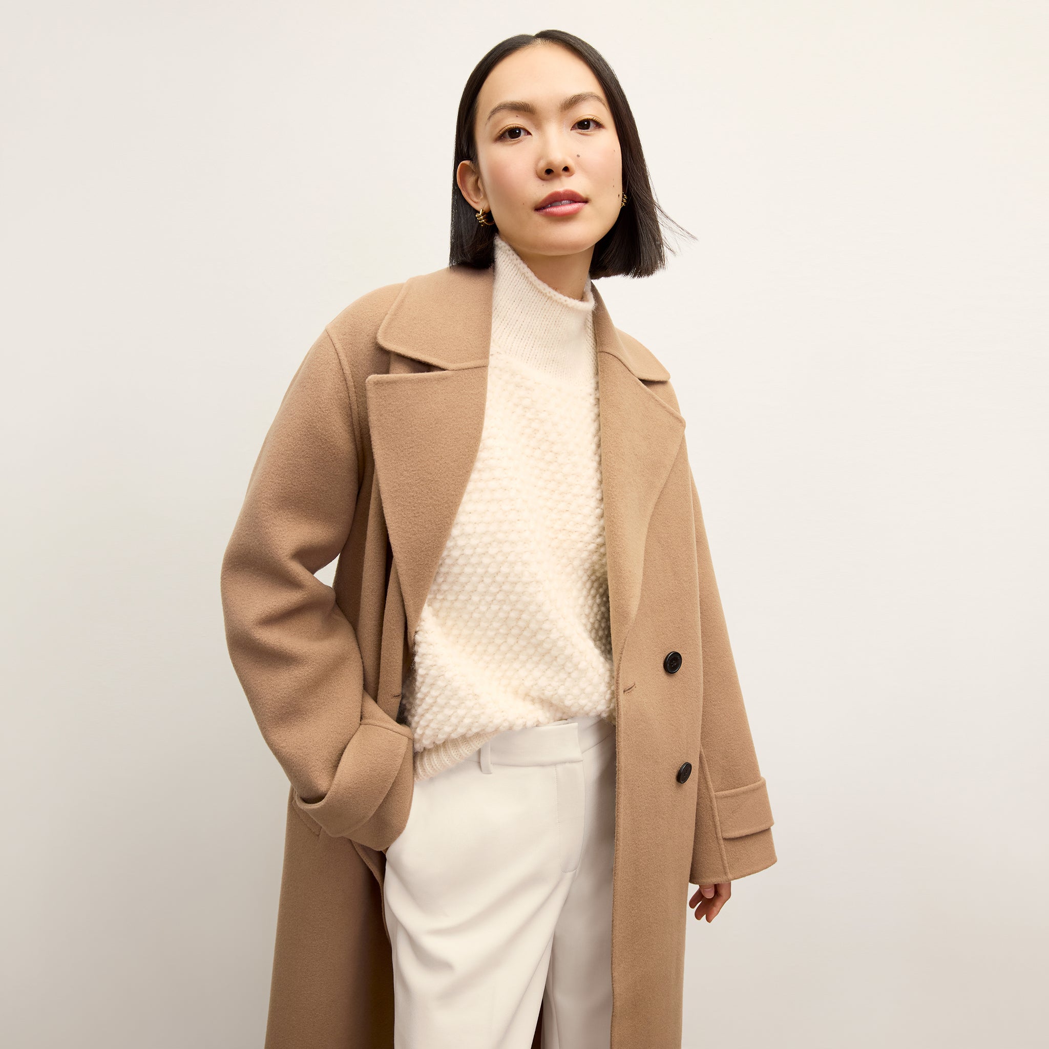 front image of a woman wearing the viola coat in camel