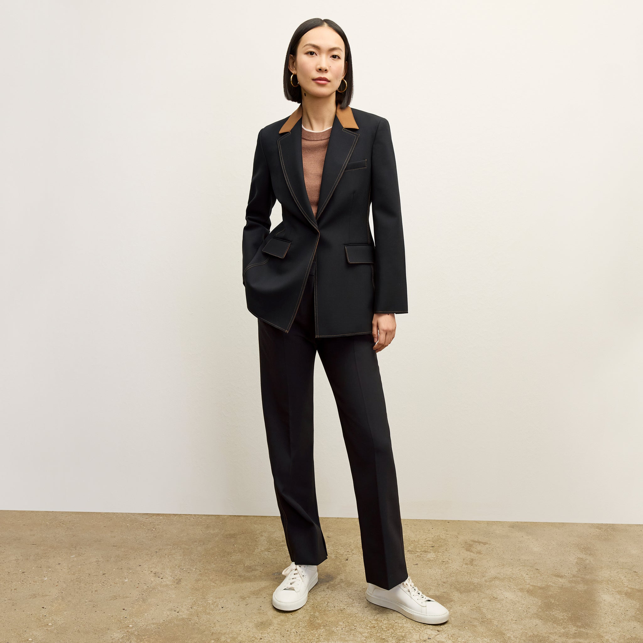 front image of a woman wearing the harley jacket in black/light saddle 