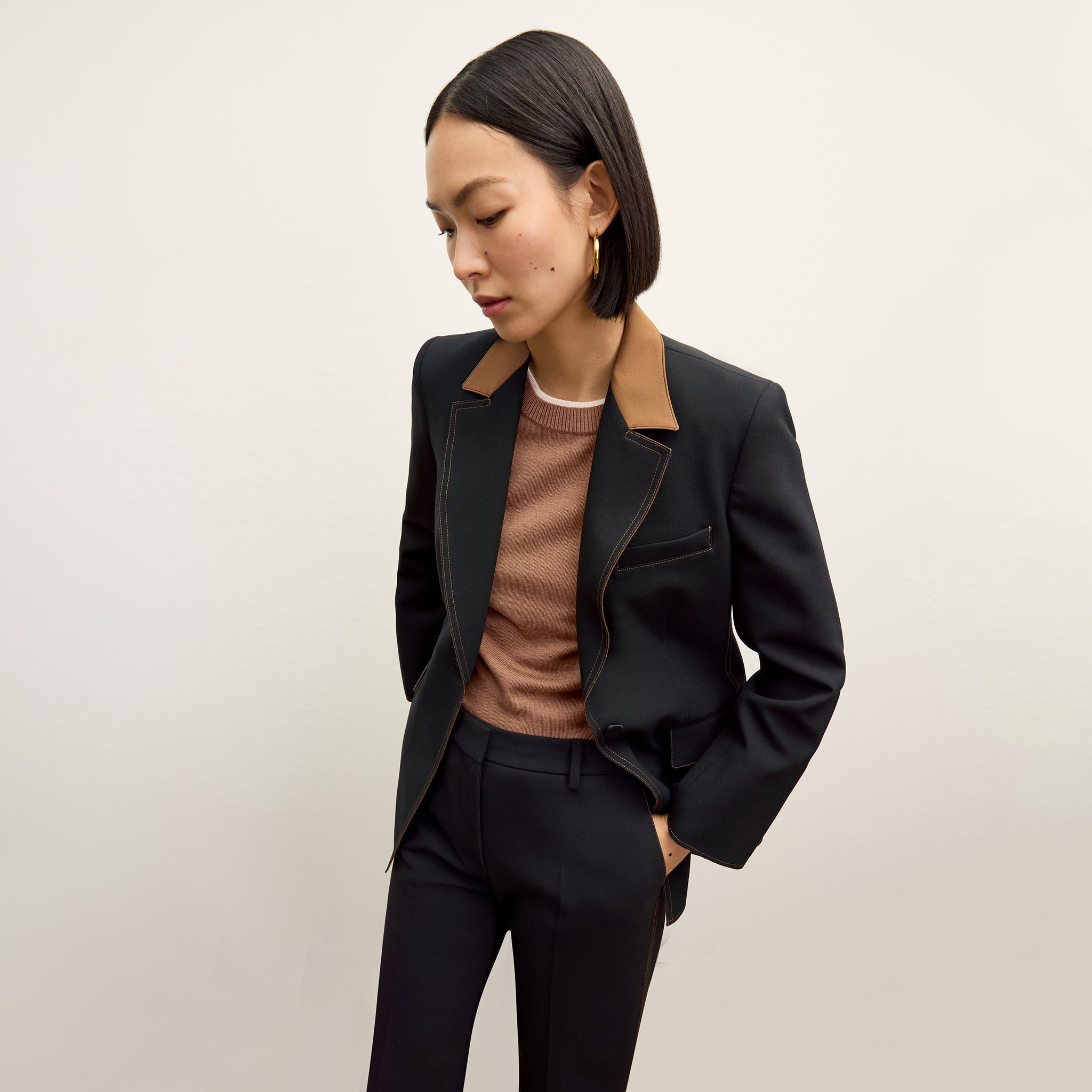 front image of a woman wearing the harley jacket in black/light saddle 