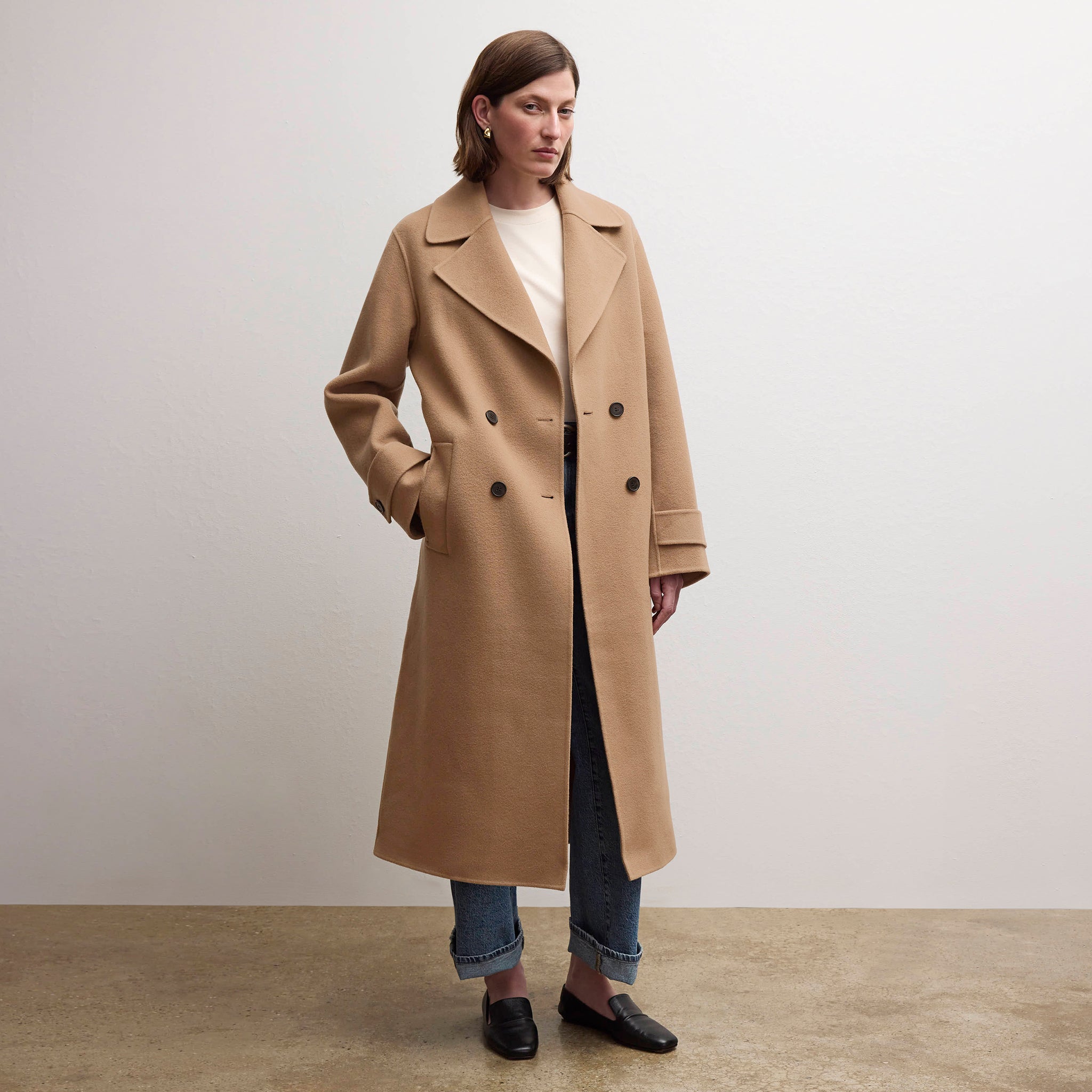 front image of a woman wearing the viola coat in camel 
