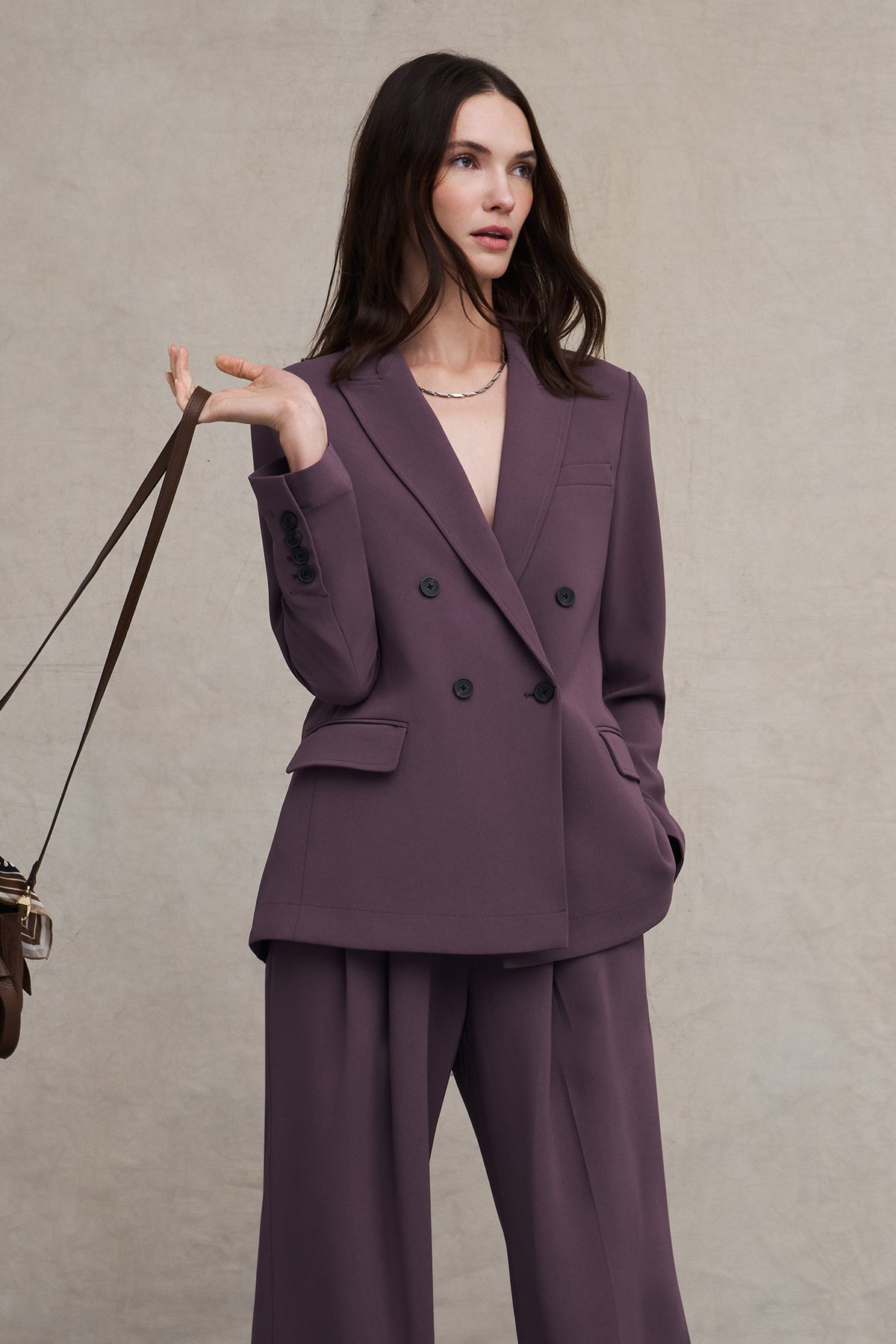 Woman wearing the Moreland Travel Blazer in black
