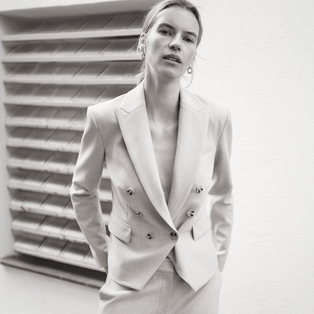Woman in beige suit.