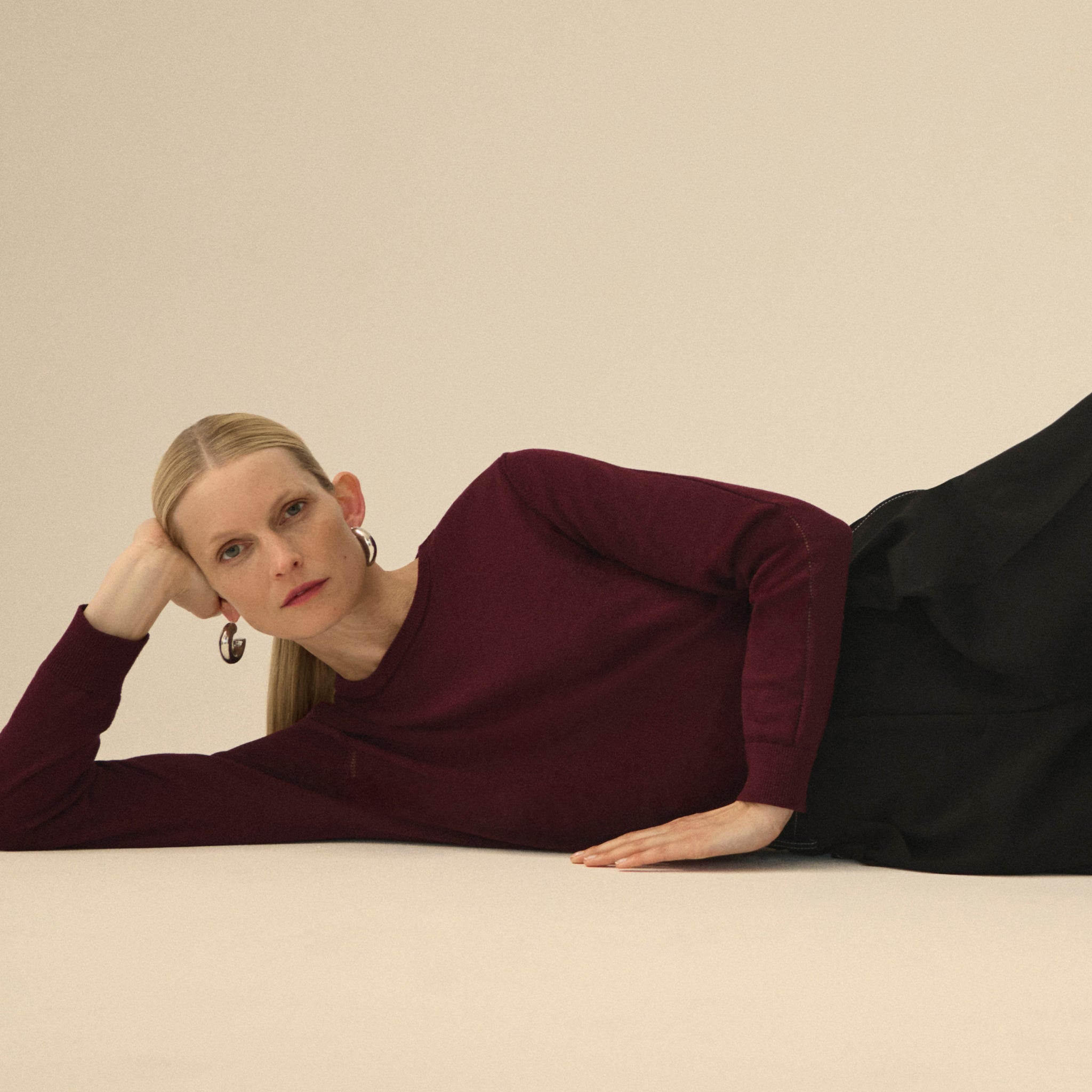 front image of a woman wearing the larissa sweater in syrah