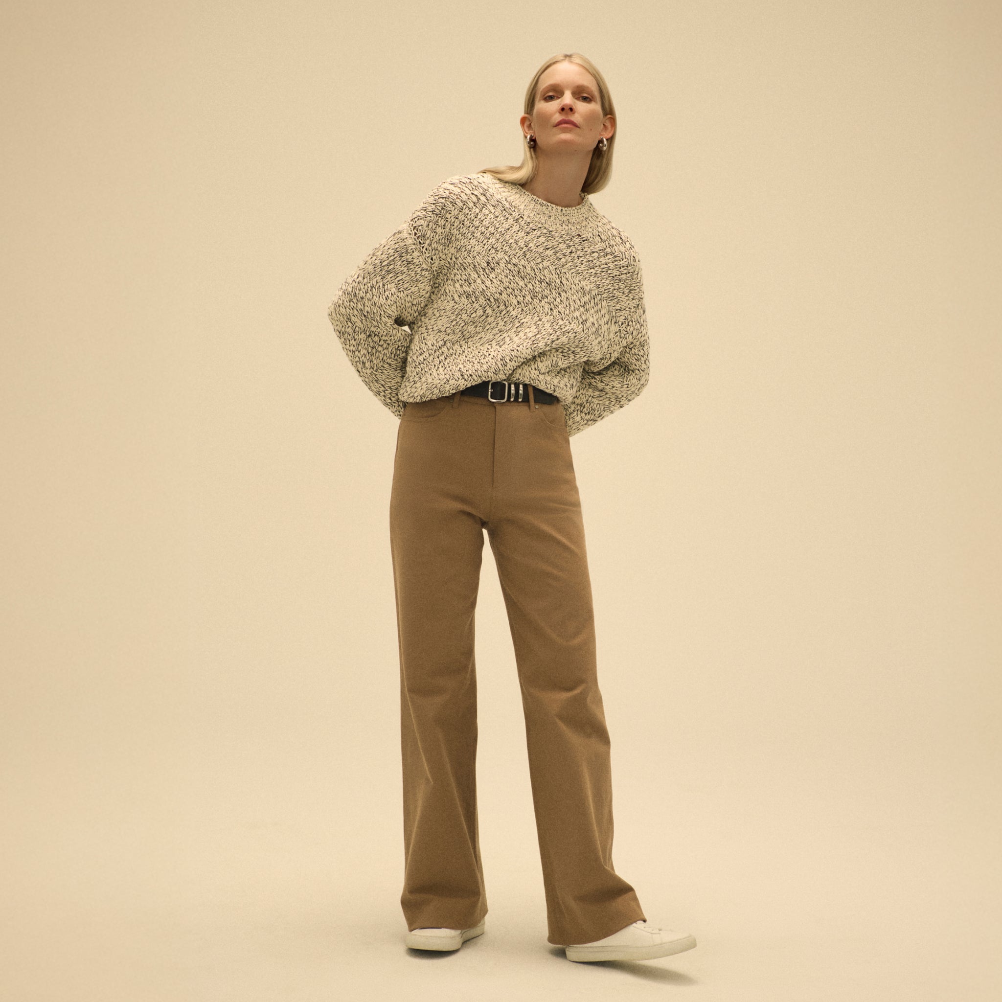 front image of a woman wearing the milo jean in saddle