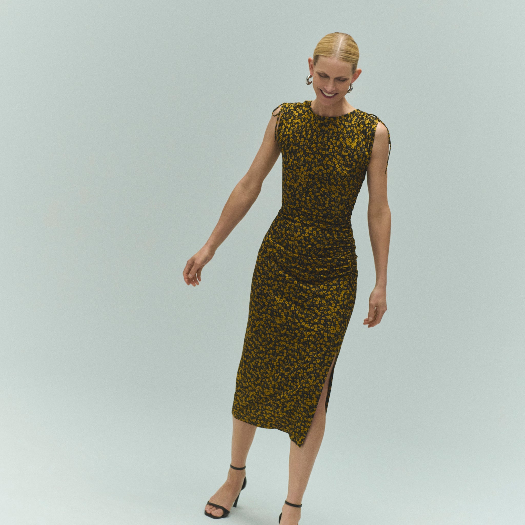 front image of a woman wearing the aisling dress in bloom print