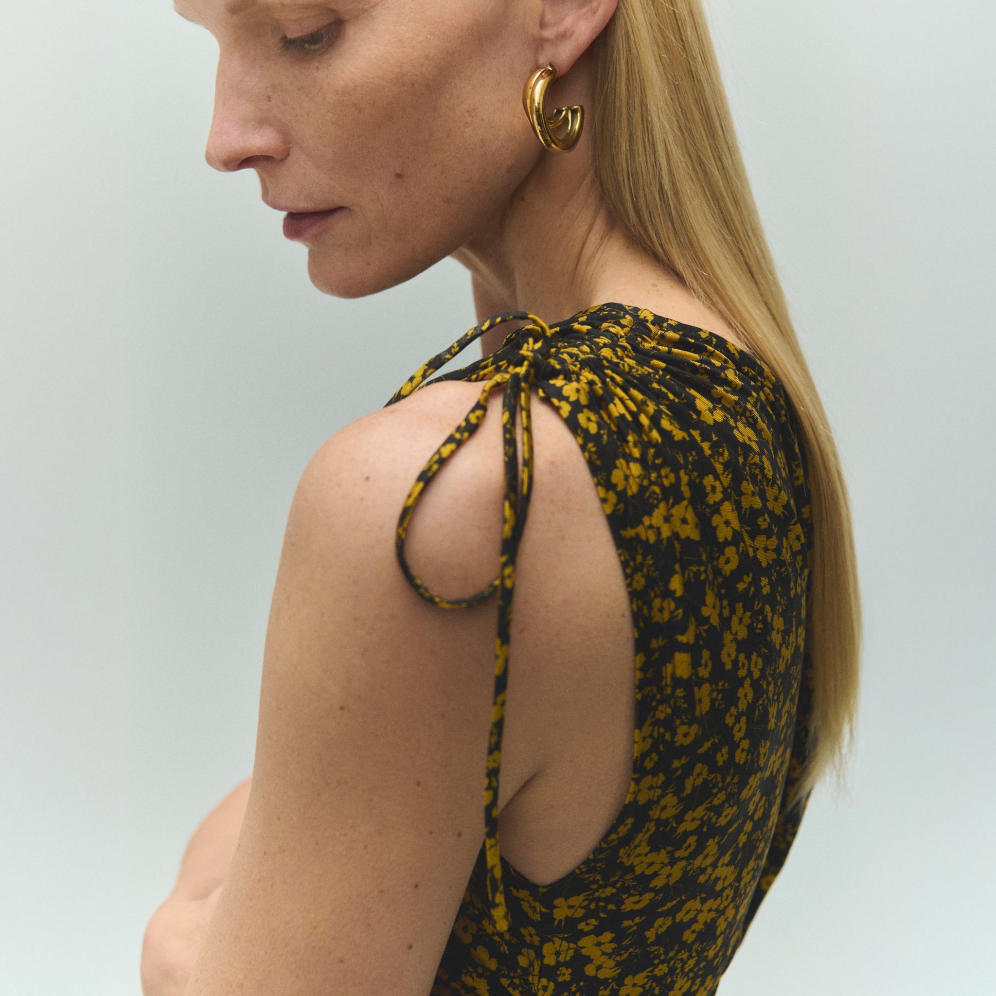 detail image of a woman wearing the aisling dress in bloom print