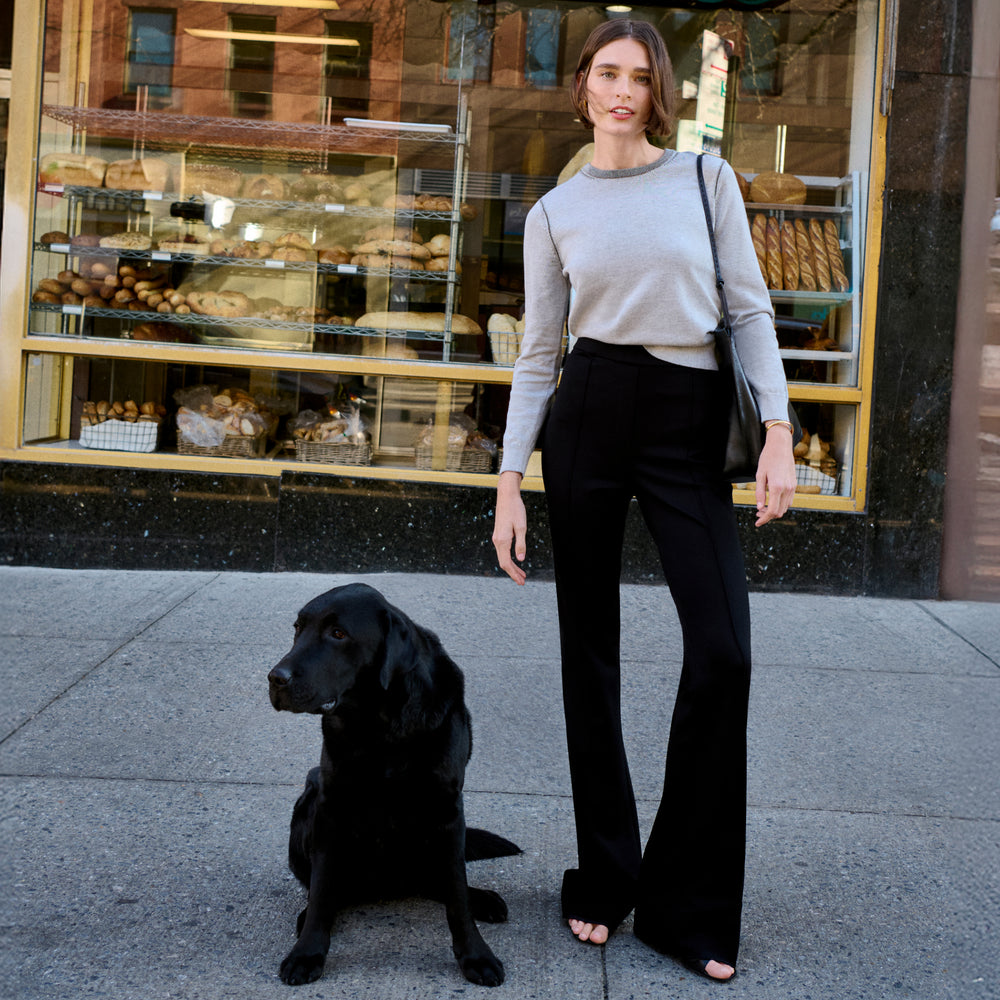 Front image of a woman wearing the larissa sweat in light gray/ivory