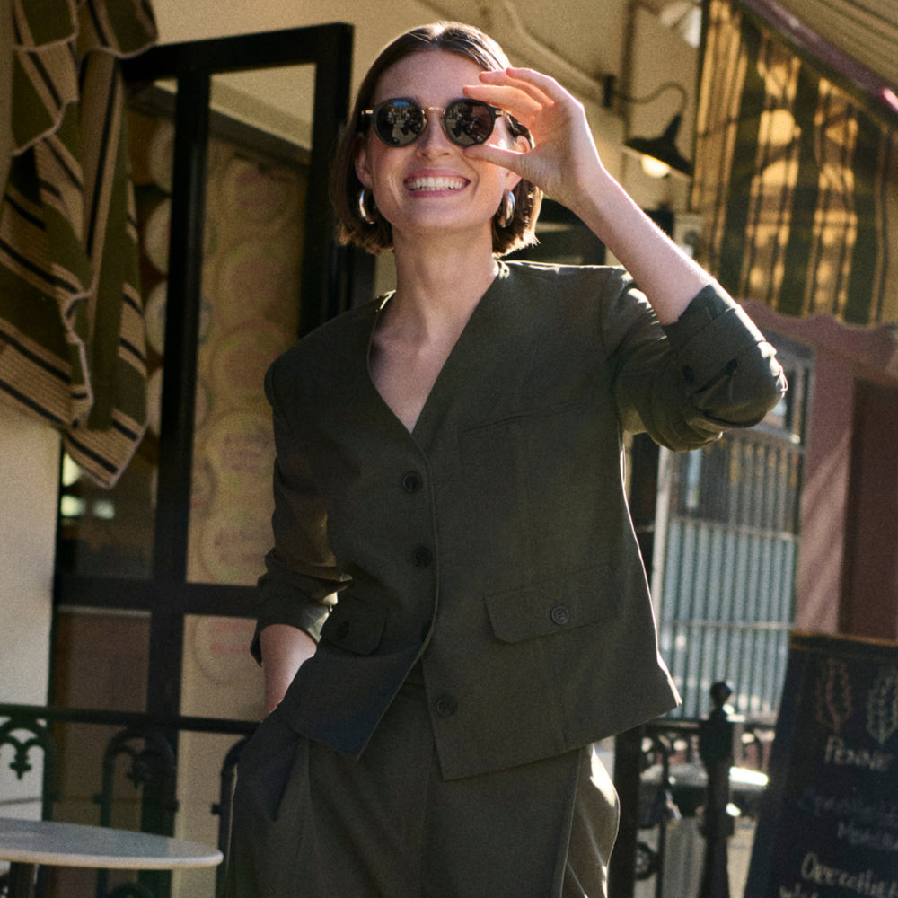 Front image of a woman wearing the Ayla Jacket in Olive