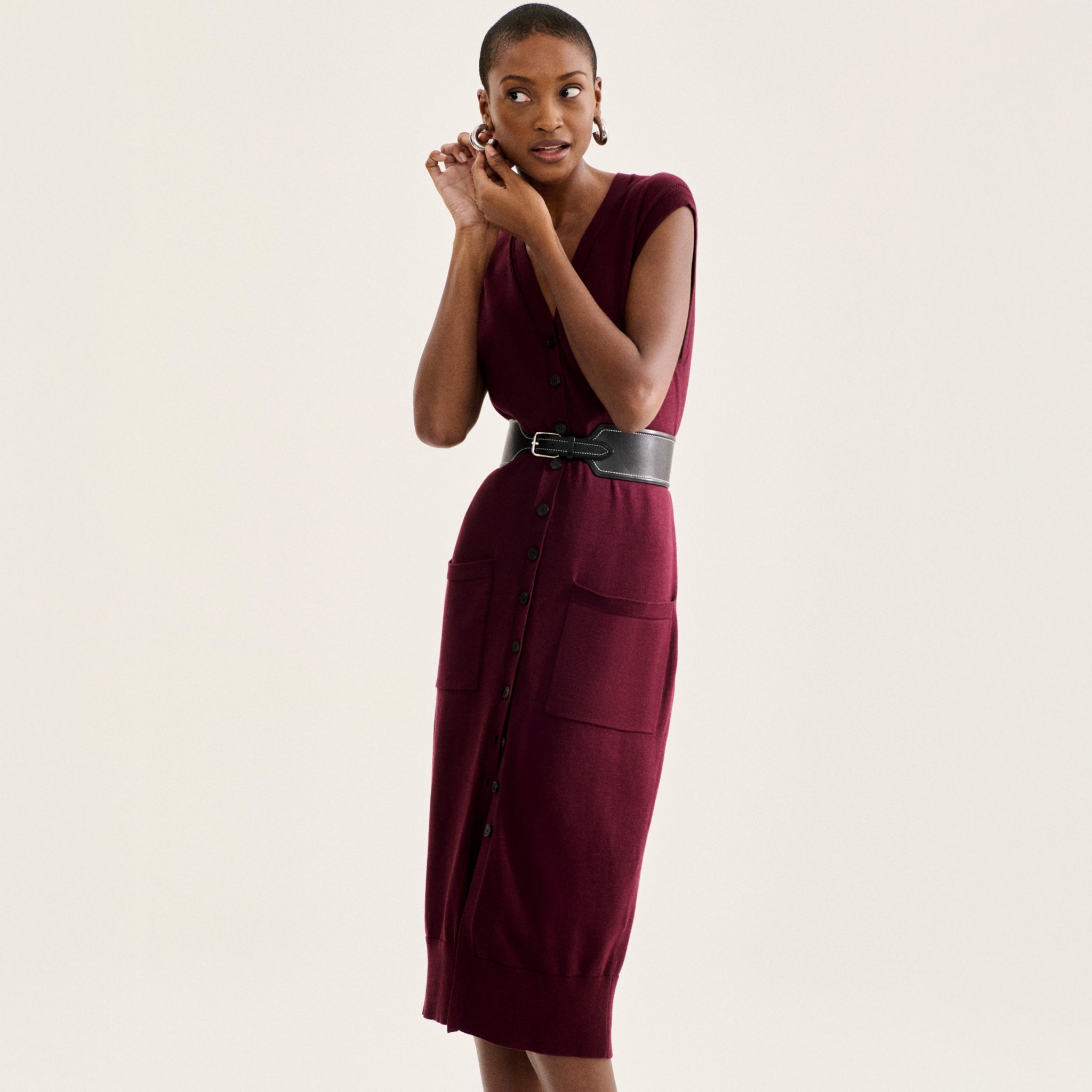 front image of a woman wearing the toula dress in syrah