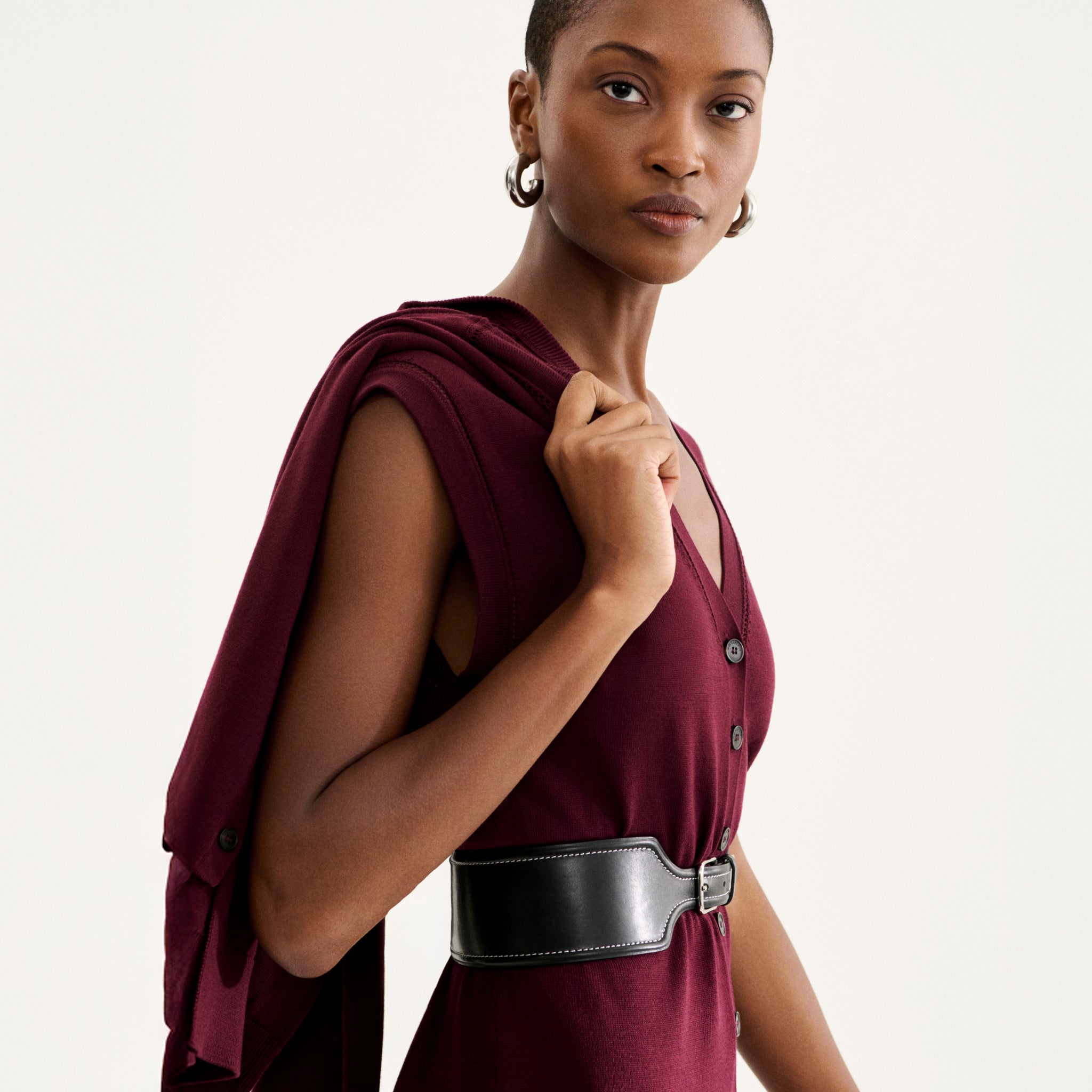 front image of a woman wearing the toula dress in syrah