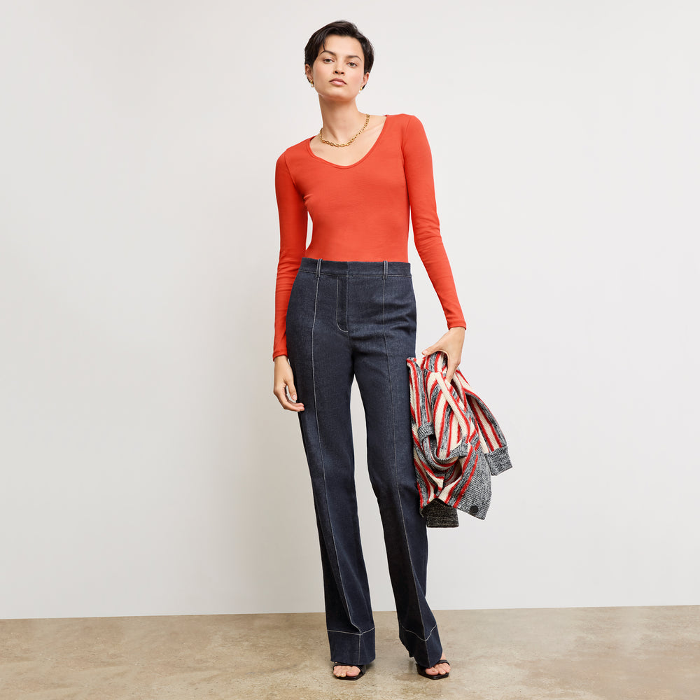 front image of a woman wearing the rowe pant in midnight wash