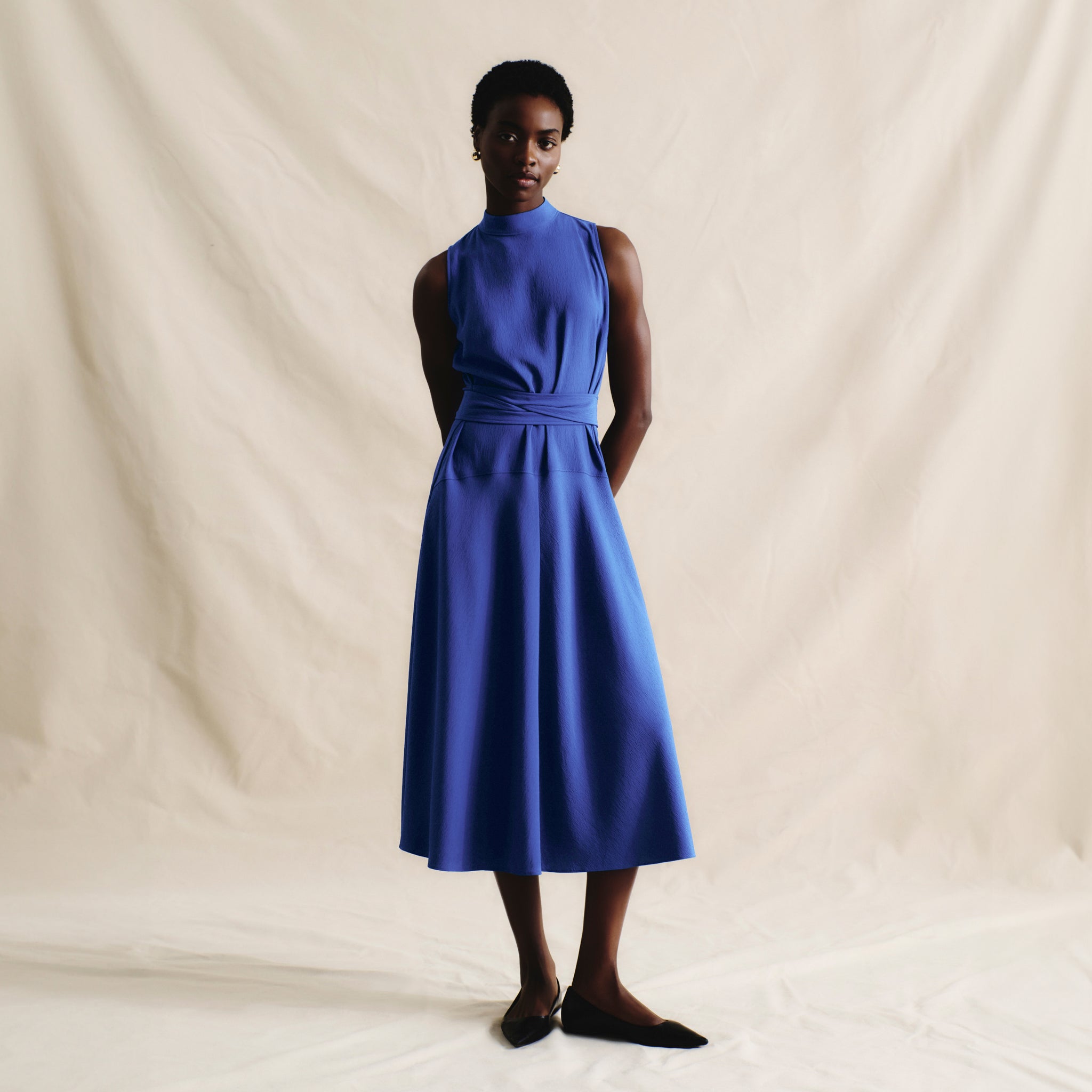 front image of a woman wearing the martina dress in royal blue