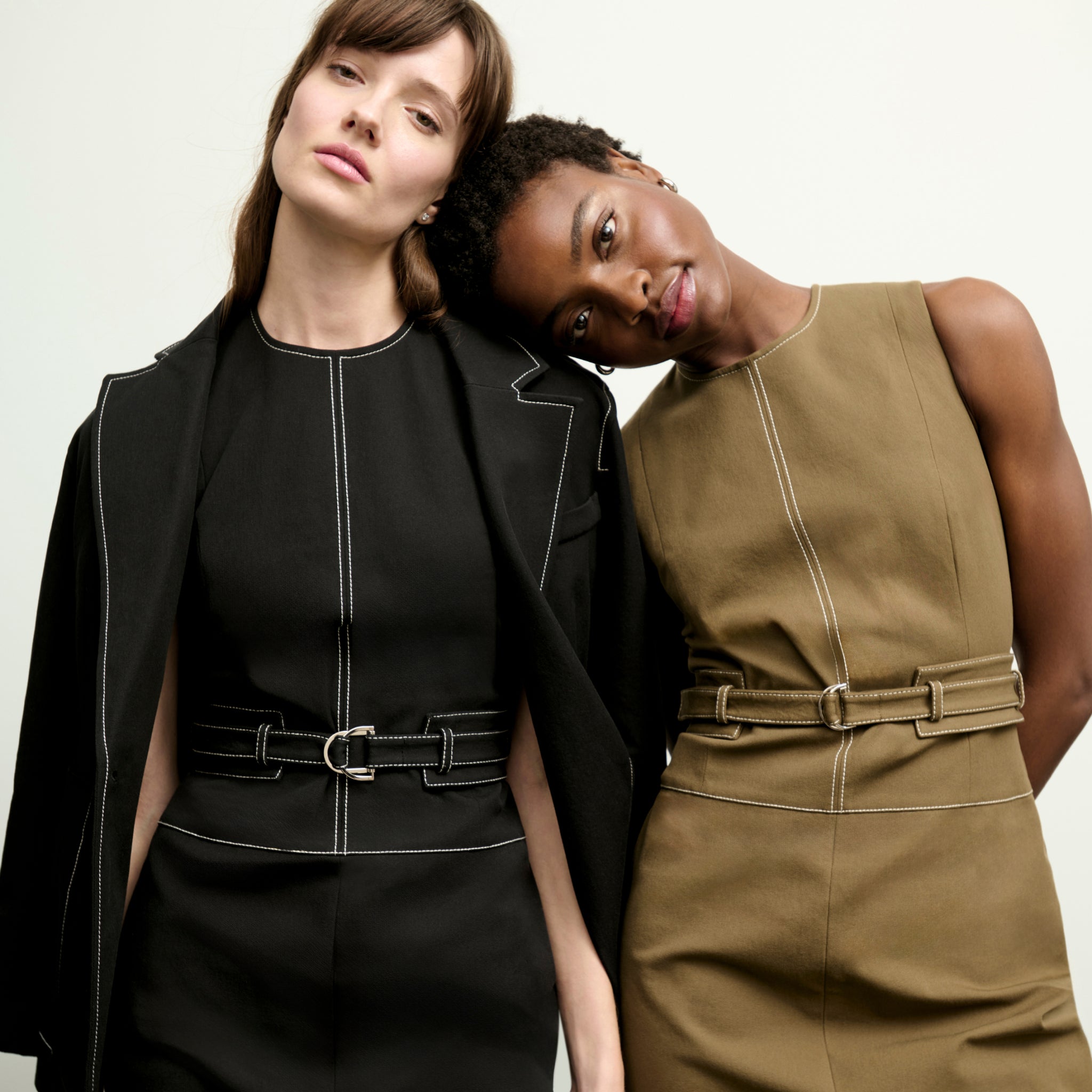mood image of two women wearing the maude dress in both black and oregano