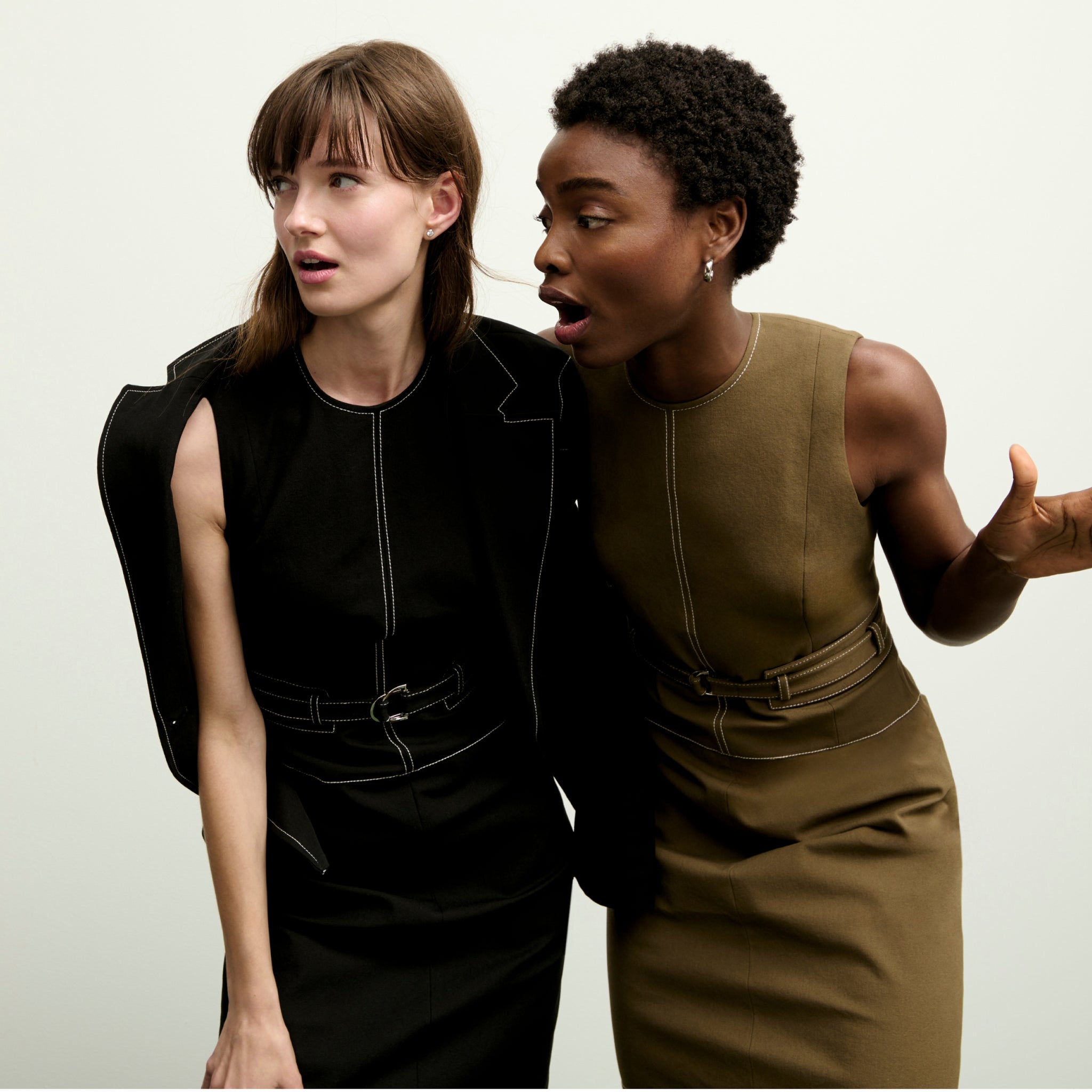 mood image of two women wearing the maude dress in both black and oregano
