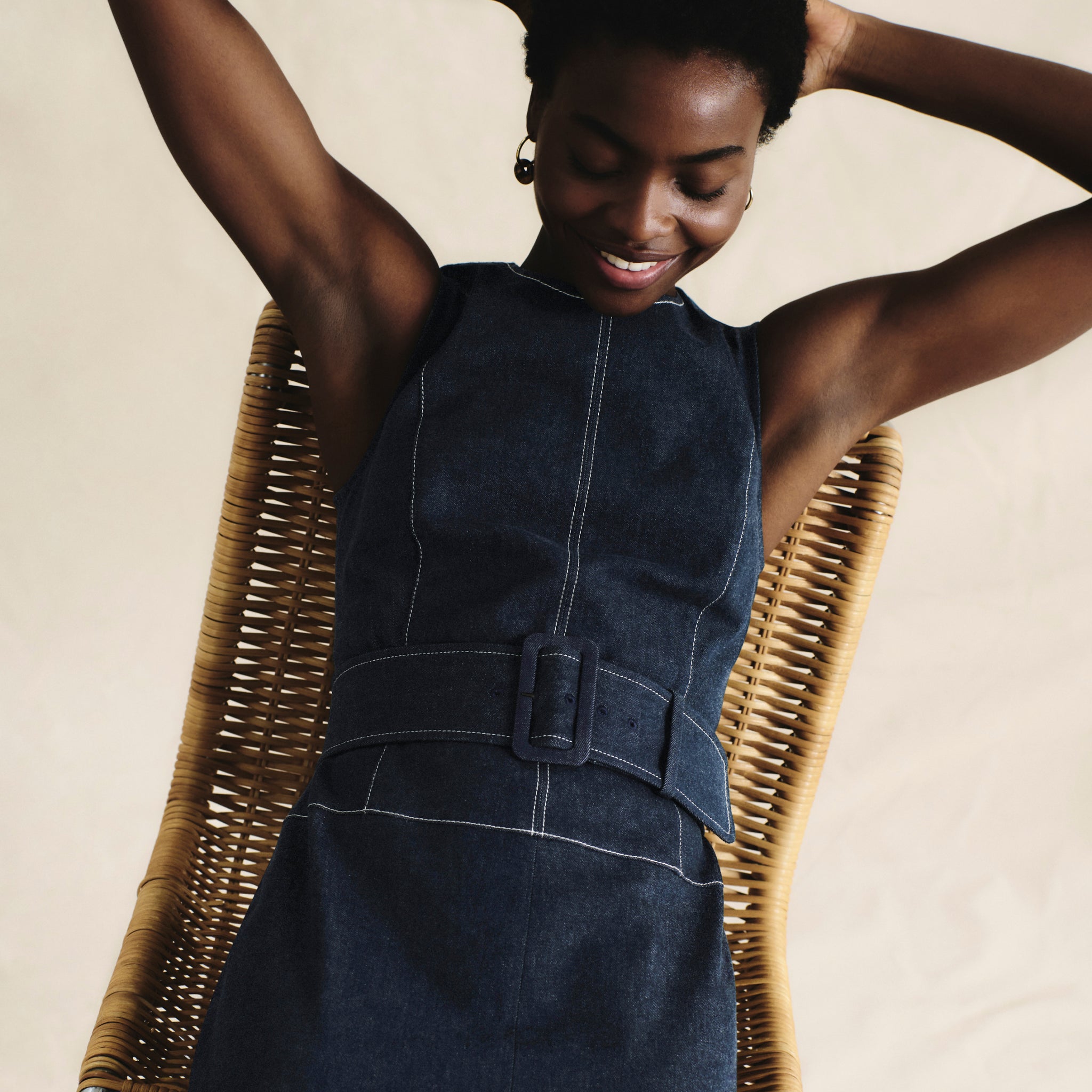 front image of a woman wearing the maude dress in dark wash
