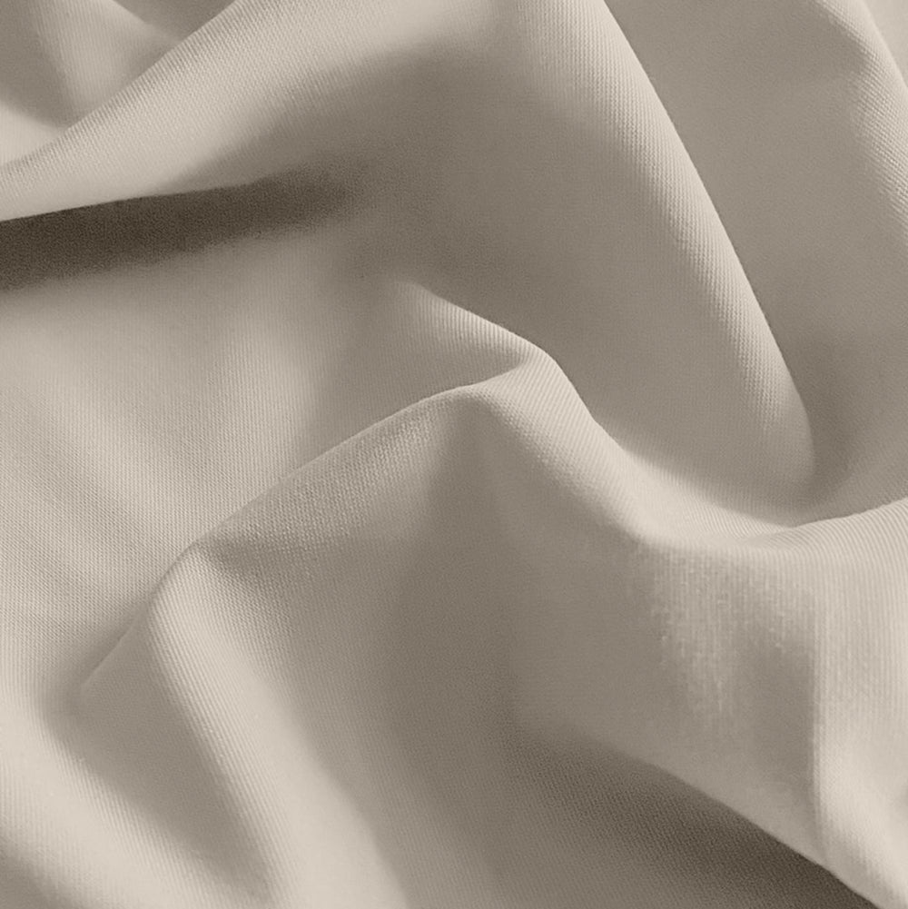 Close-up of beige fabric with folds