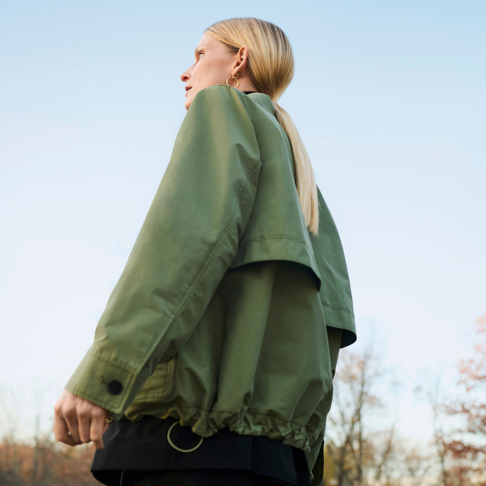 Front image of a woman wearing the Ness Jacket