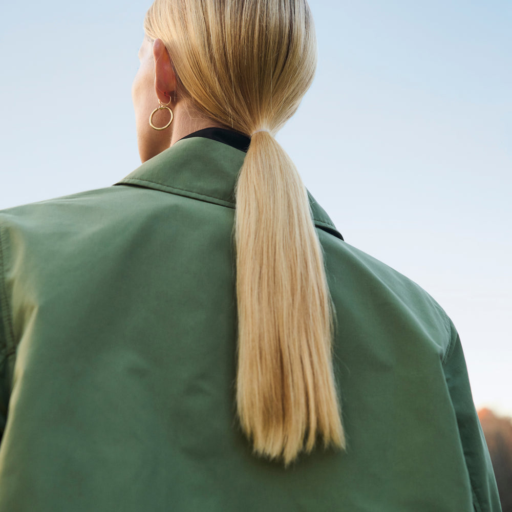Front image of a woman wearing the Ness Jacket