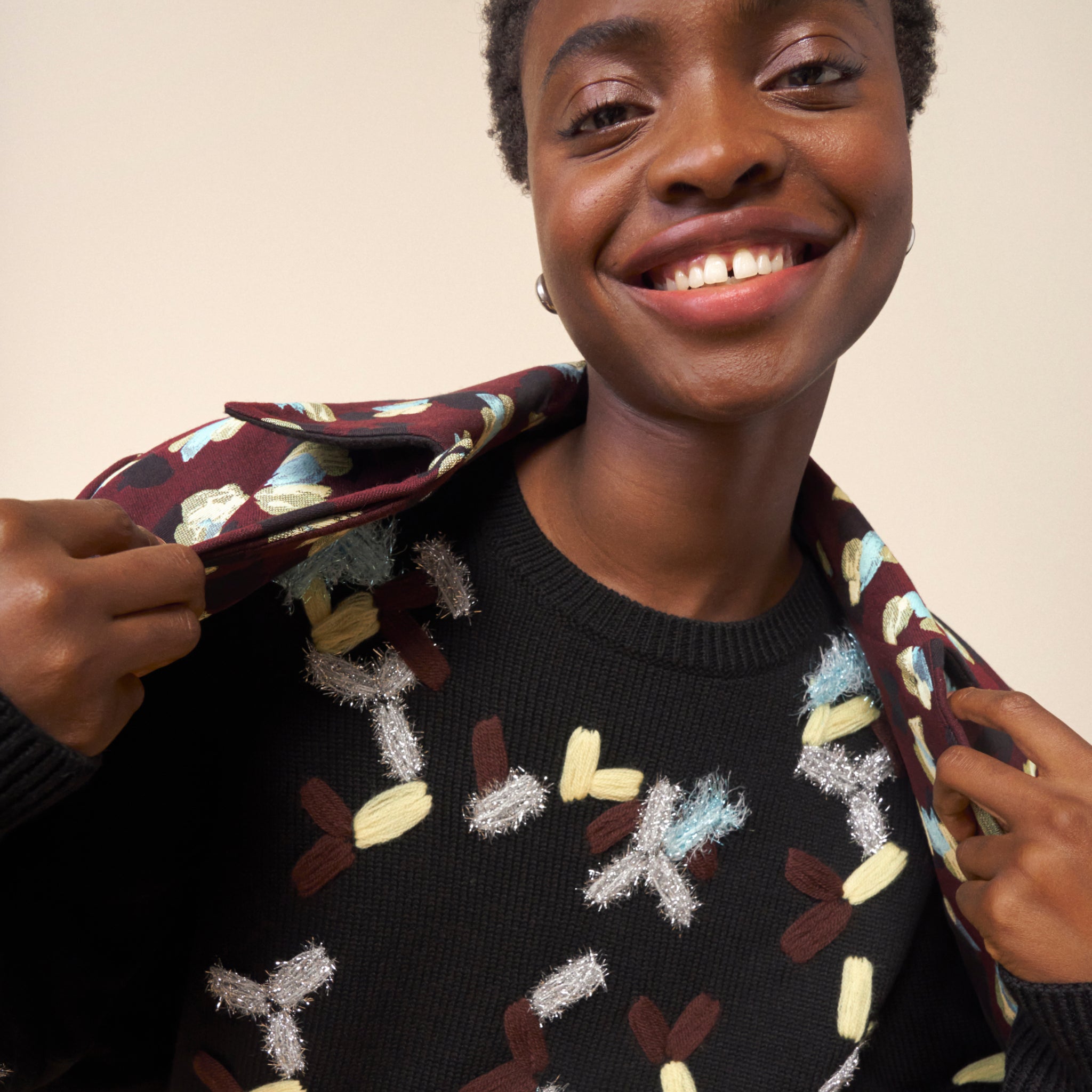 mood image of a woman wearing the tish sweater in confetti