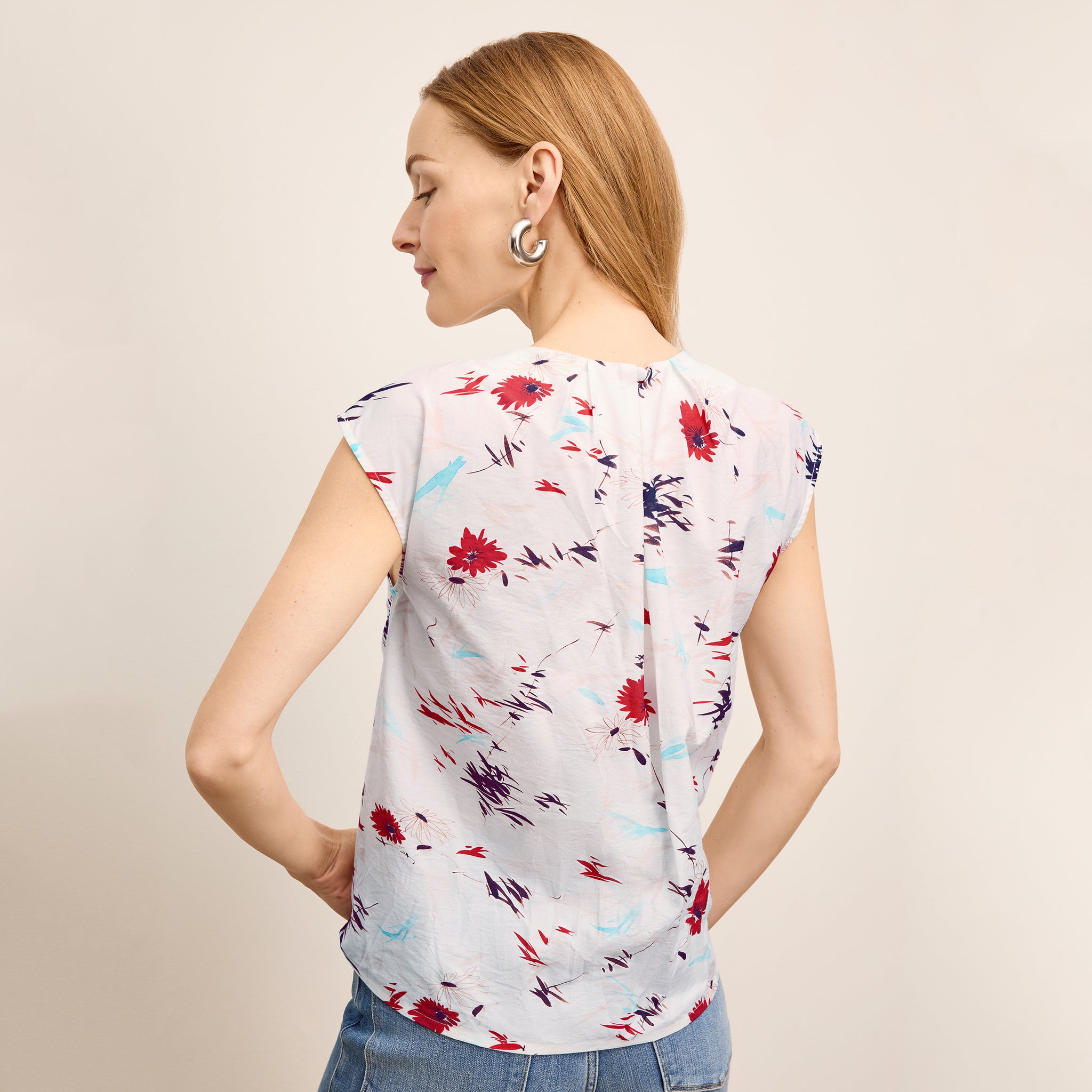 Back image of a woman wearing the Nika Top in Brushed Floral