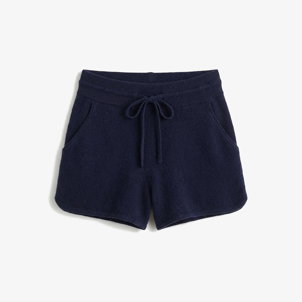 Navy blue shorts with drawstring on a white background
