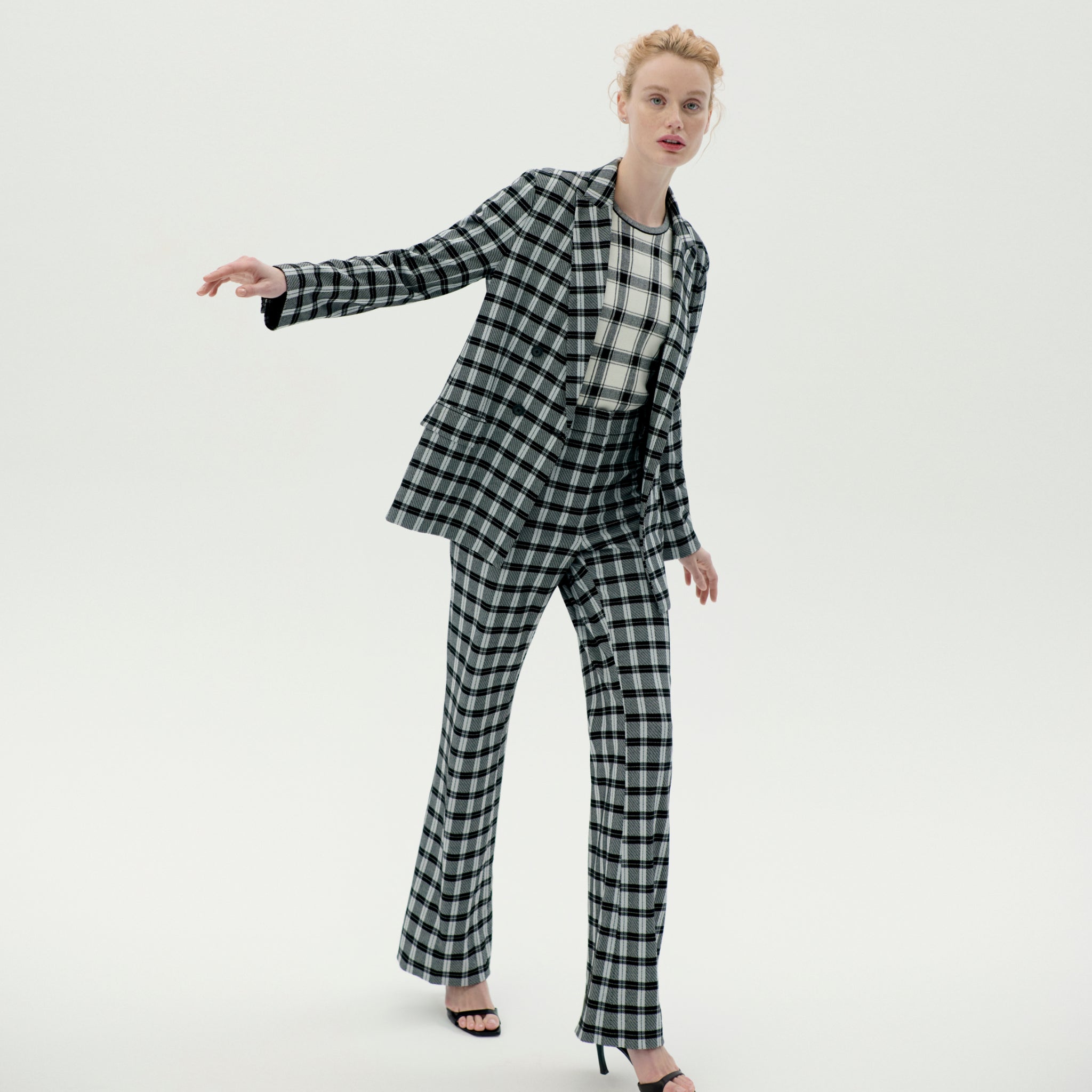 Front image of a woman wearing the horton pants in checkmate