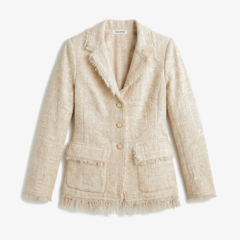 Beige textured blazer with buttons on a light background.
