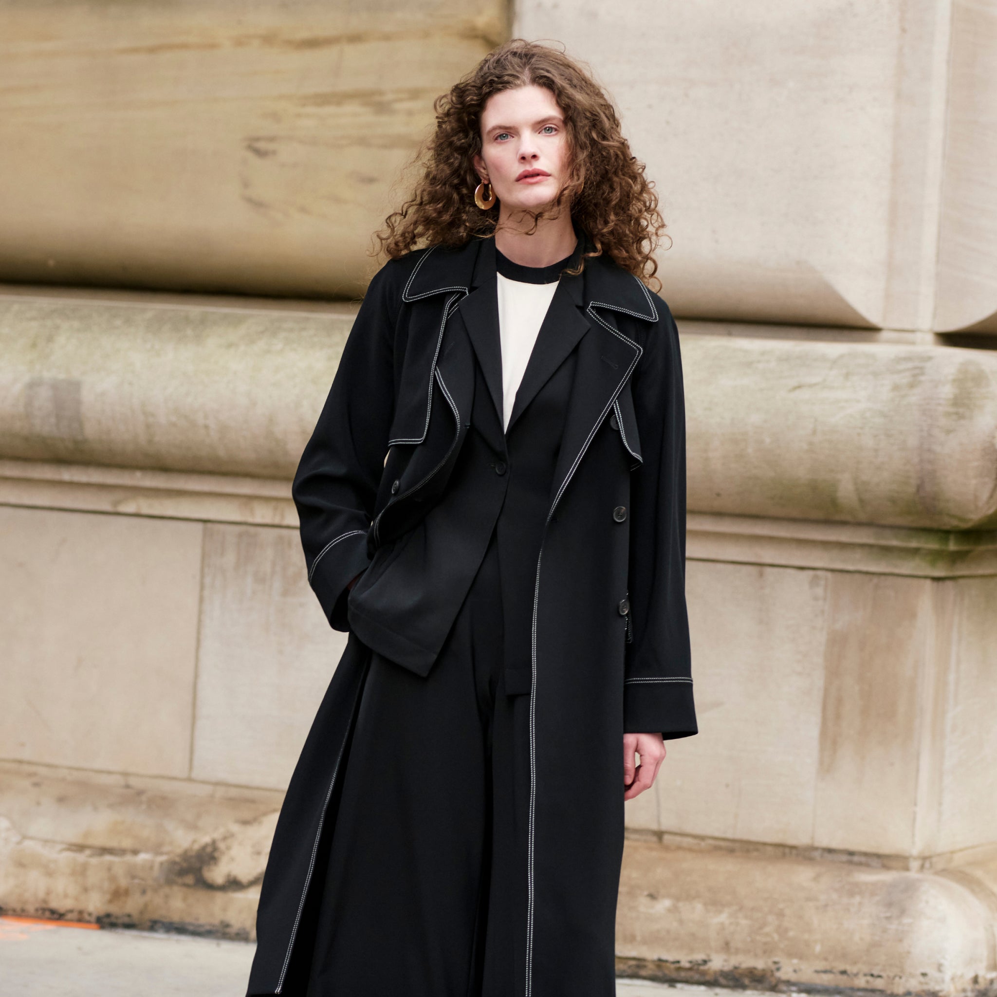 front image of a woman wearing the frankie jacket in black