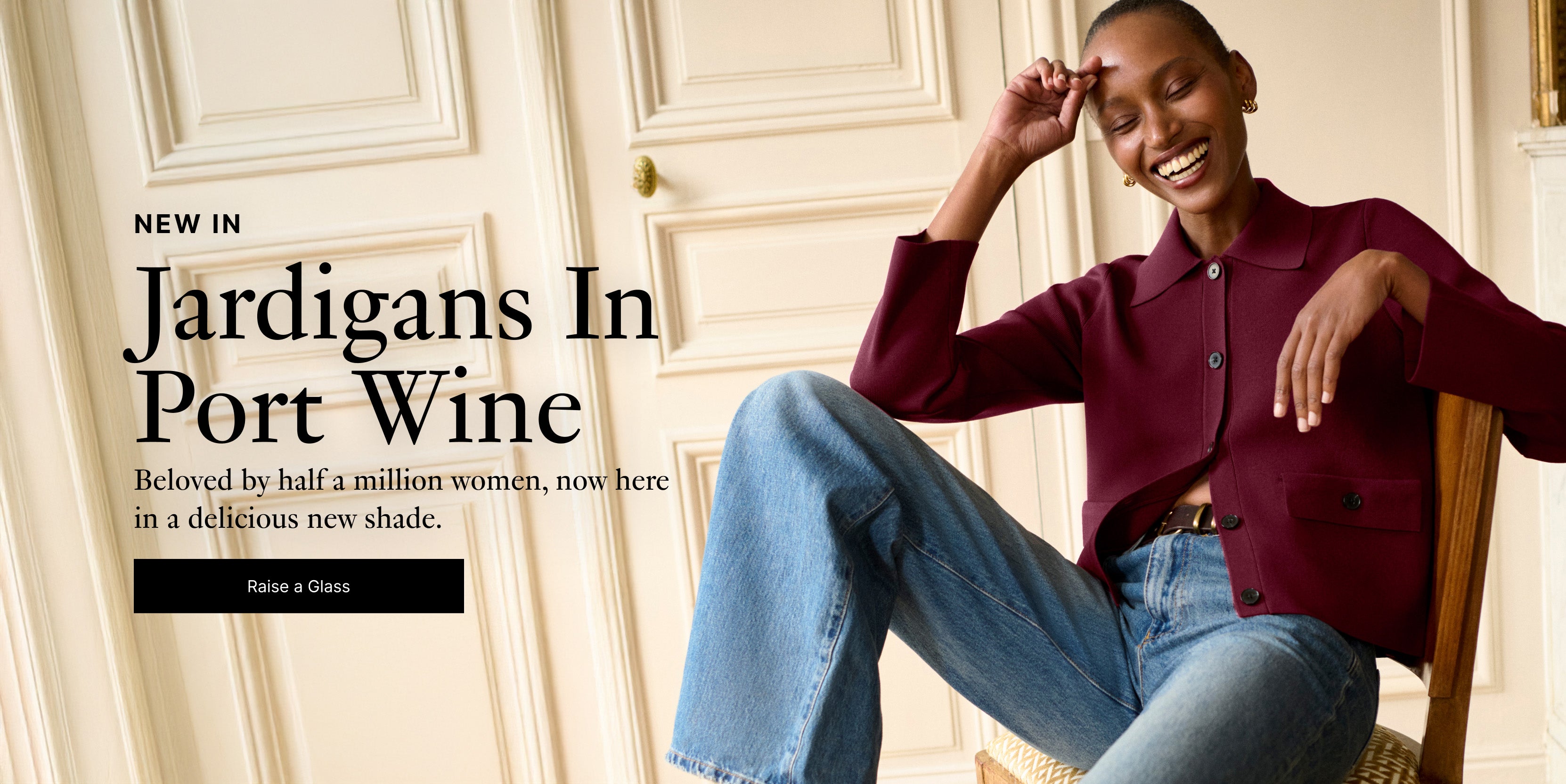 Image of a woman wearing a burgundy jardigan with blue jeans sitting in a chair with text overlaid that reads:

"NEW IN
Jardigans In Port Wine
Beloved by half a million women now here in a delicious new shade.
Raise a Glass"