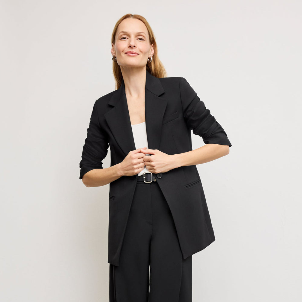 front image of a woman wearing the rossi blazer in black