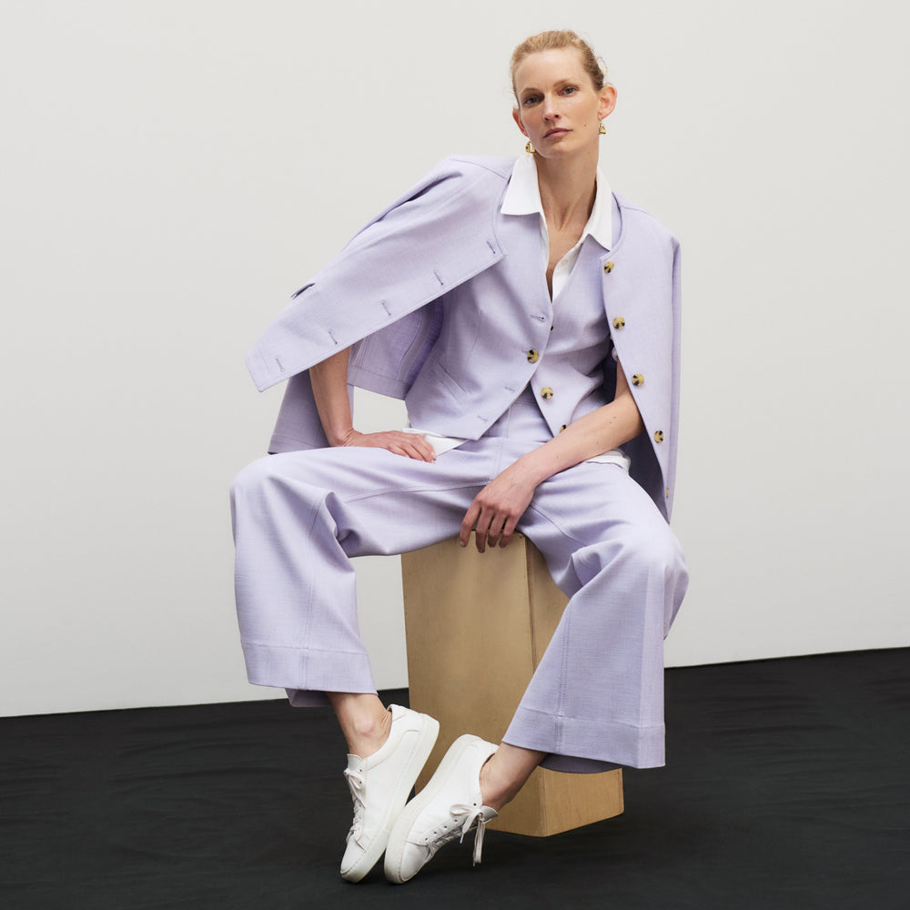 front image of a woman wearing the aniya jacket in lilac/ivory