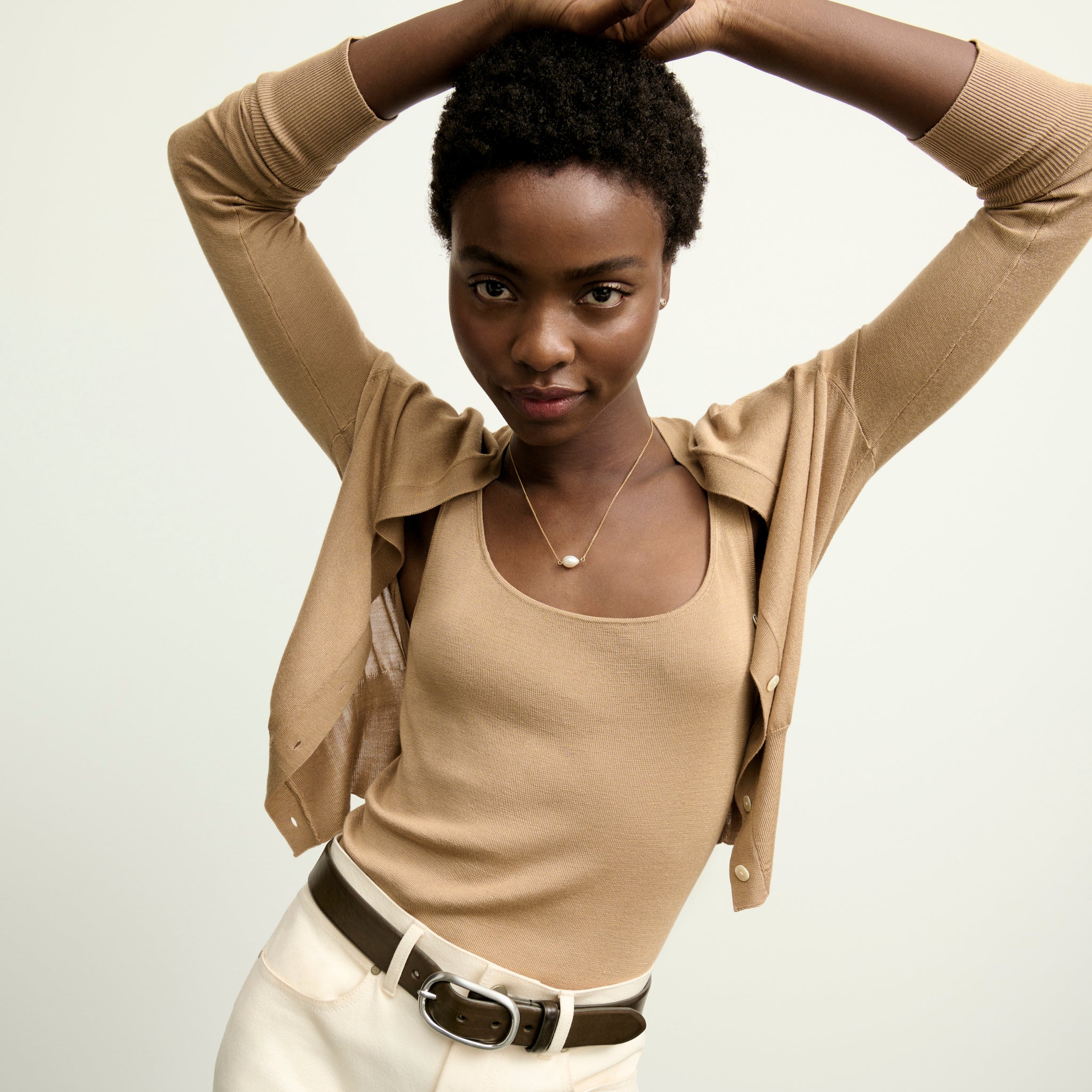 image of a woman wearing the delphine top in camel
