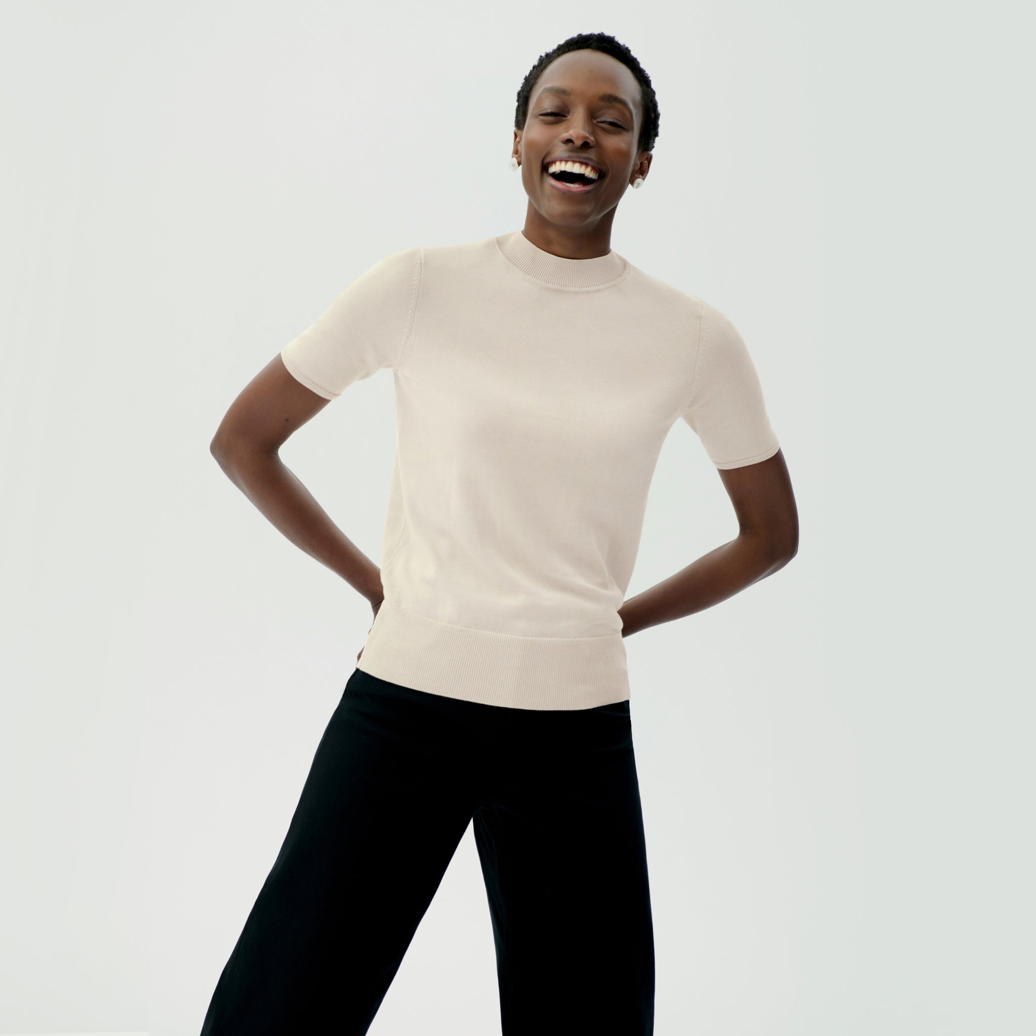 front image of a woman wearing the shani top in ivory