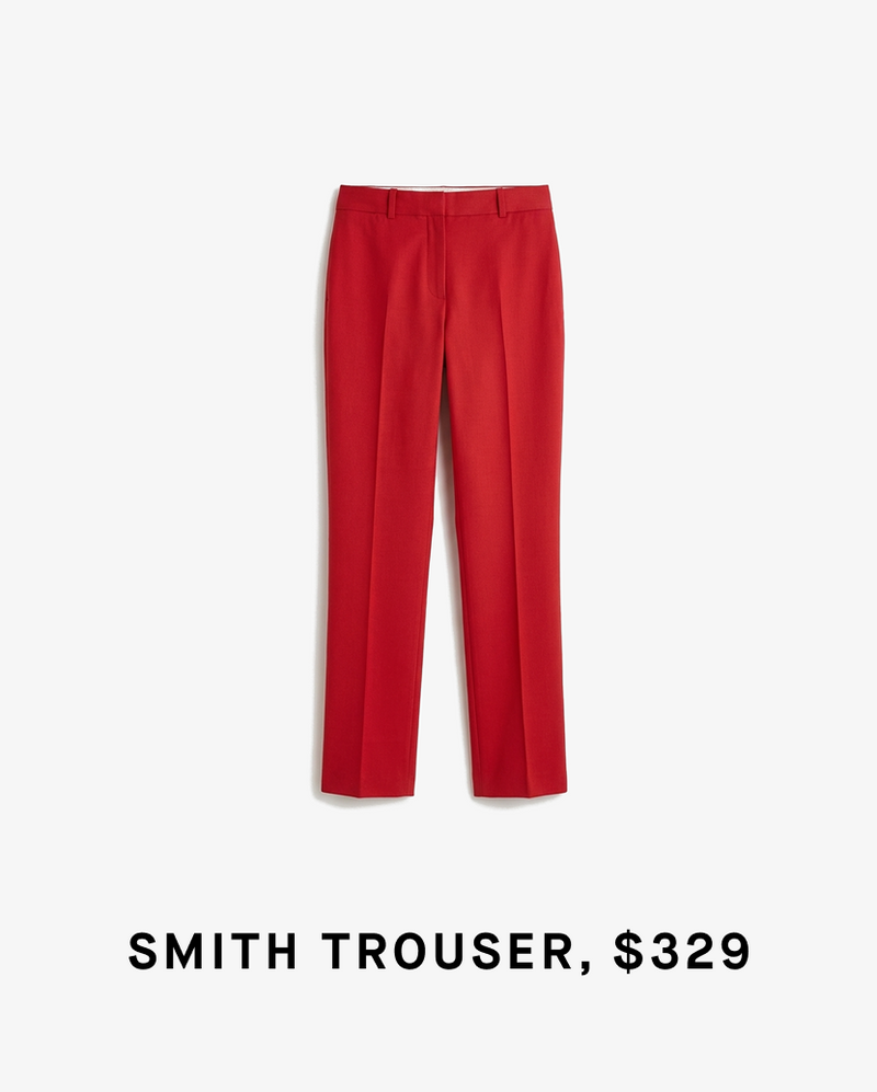 Red trousers on a white background with text indicating price and product name. "SMITH TROUSER, $329"