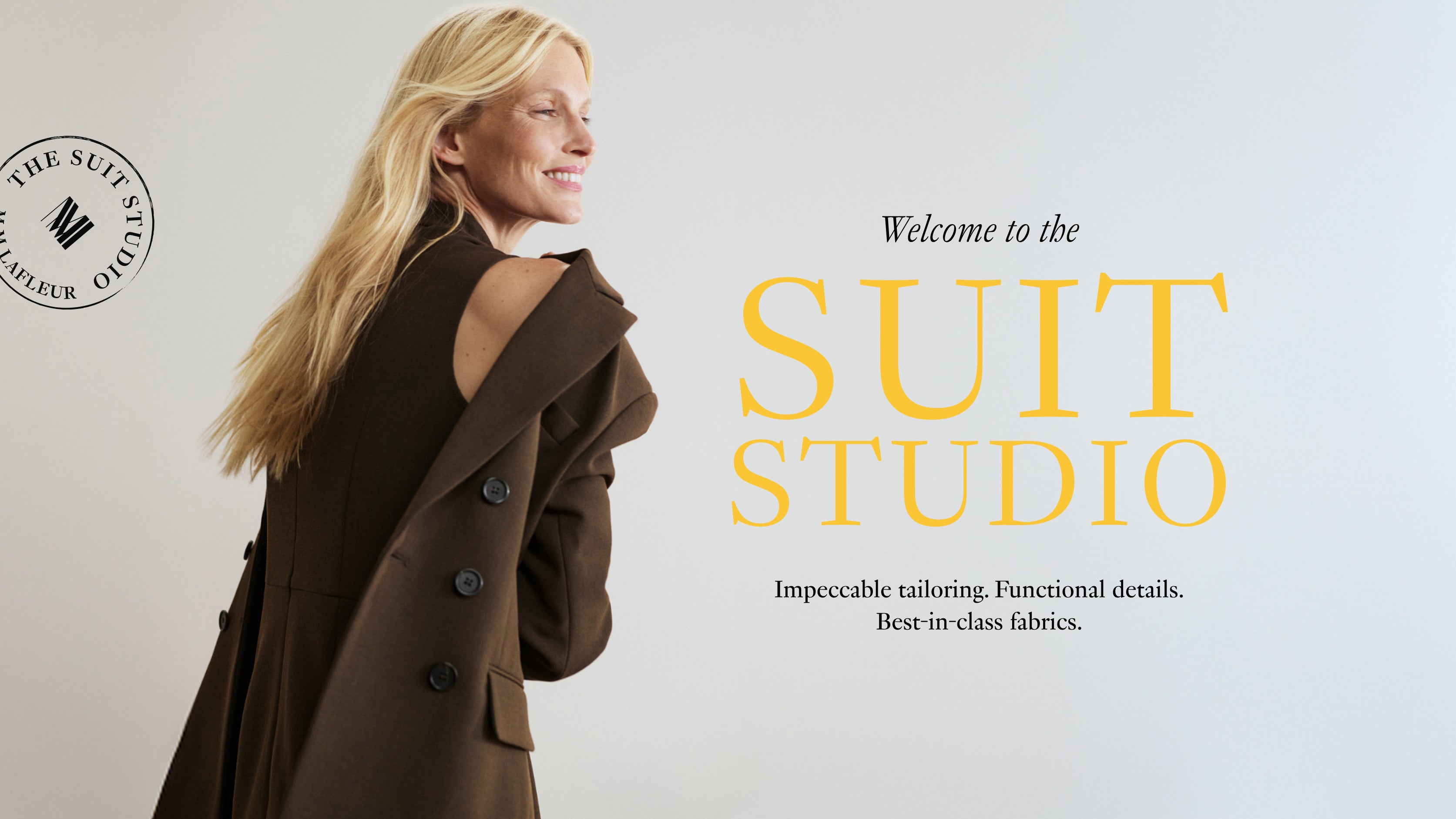 Woman in a brown suit with 'The Suit Studio' branding on a light gray background