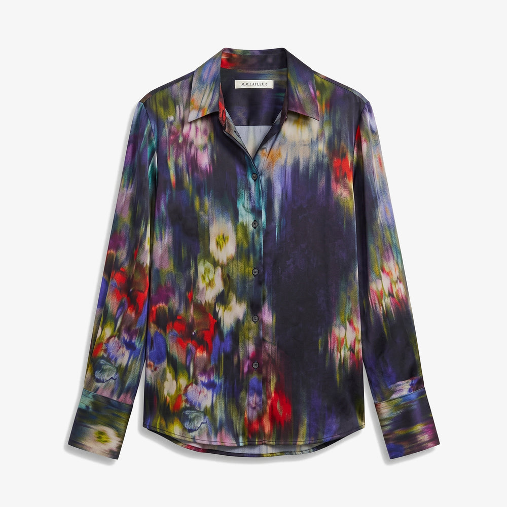 A long-sleeve button-up shirt featuring a dark, painterly floral pattern with purple, blue, red, and yellow tones, displayed on a clean white background.