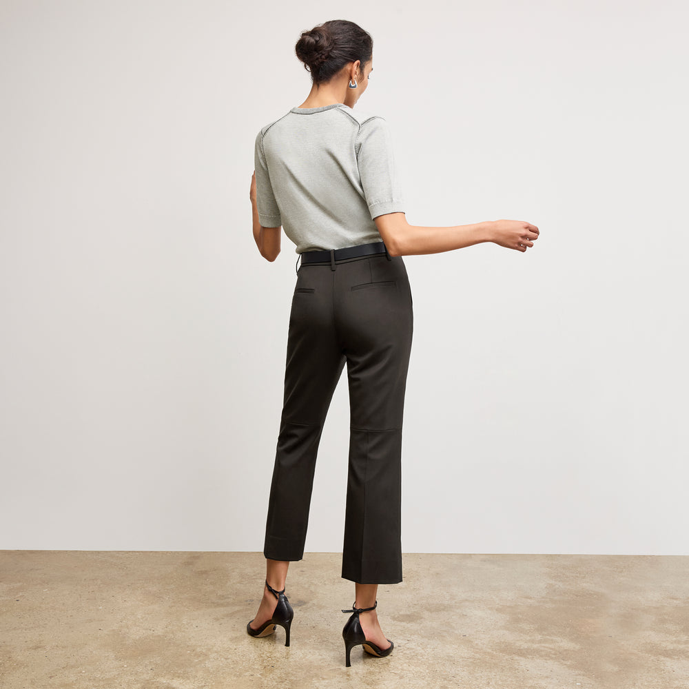Back image of a woman wearing the becca top in light gray/ivory