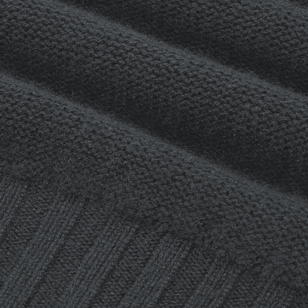 Close-up of a dark gray textured fabric