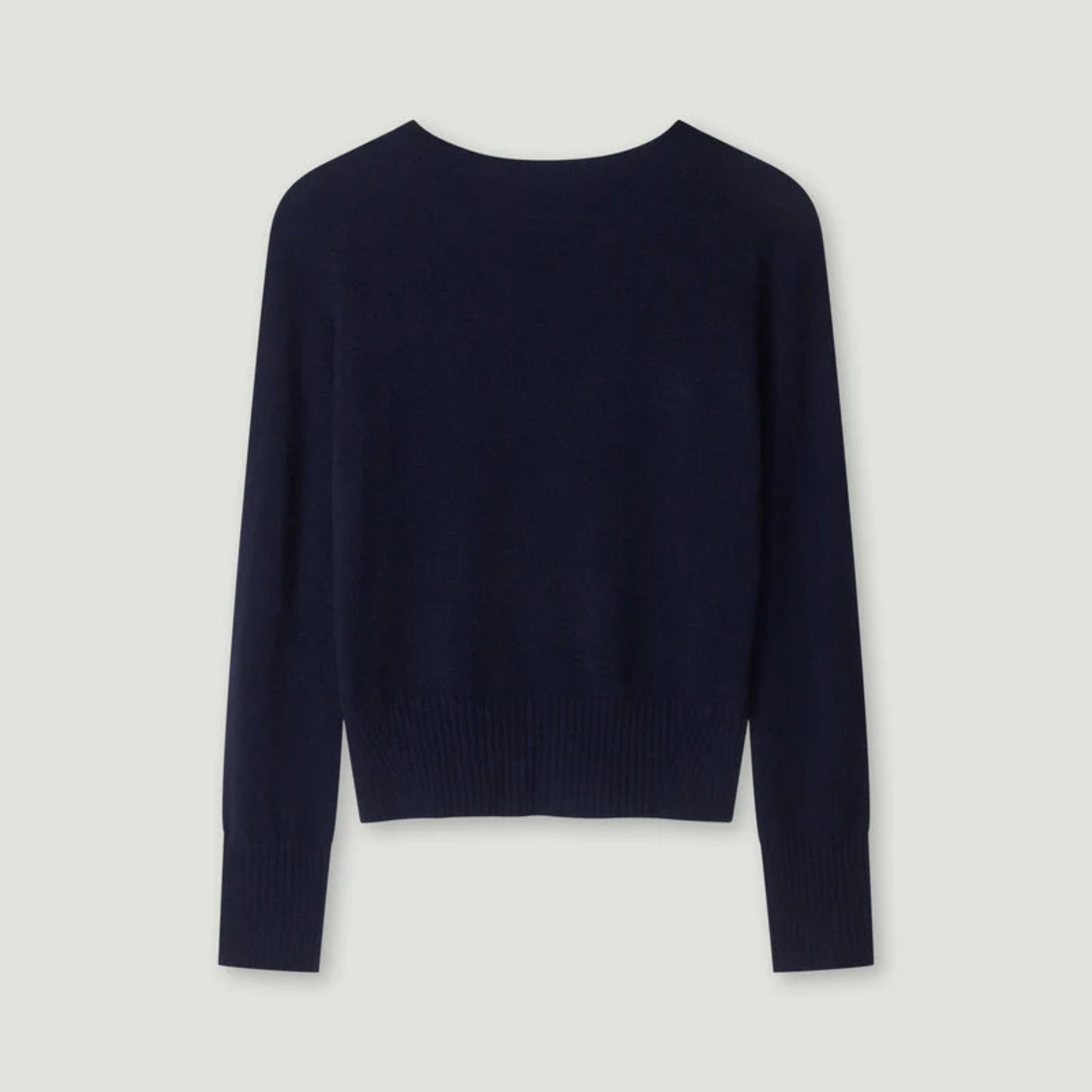 Navy blue sweater on a light gray background