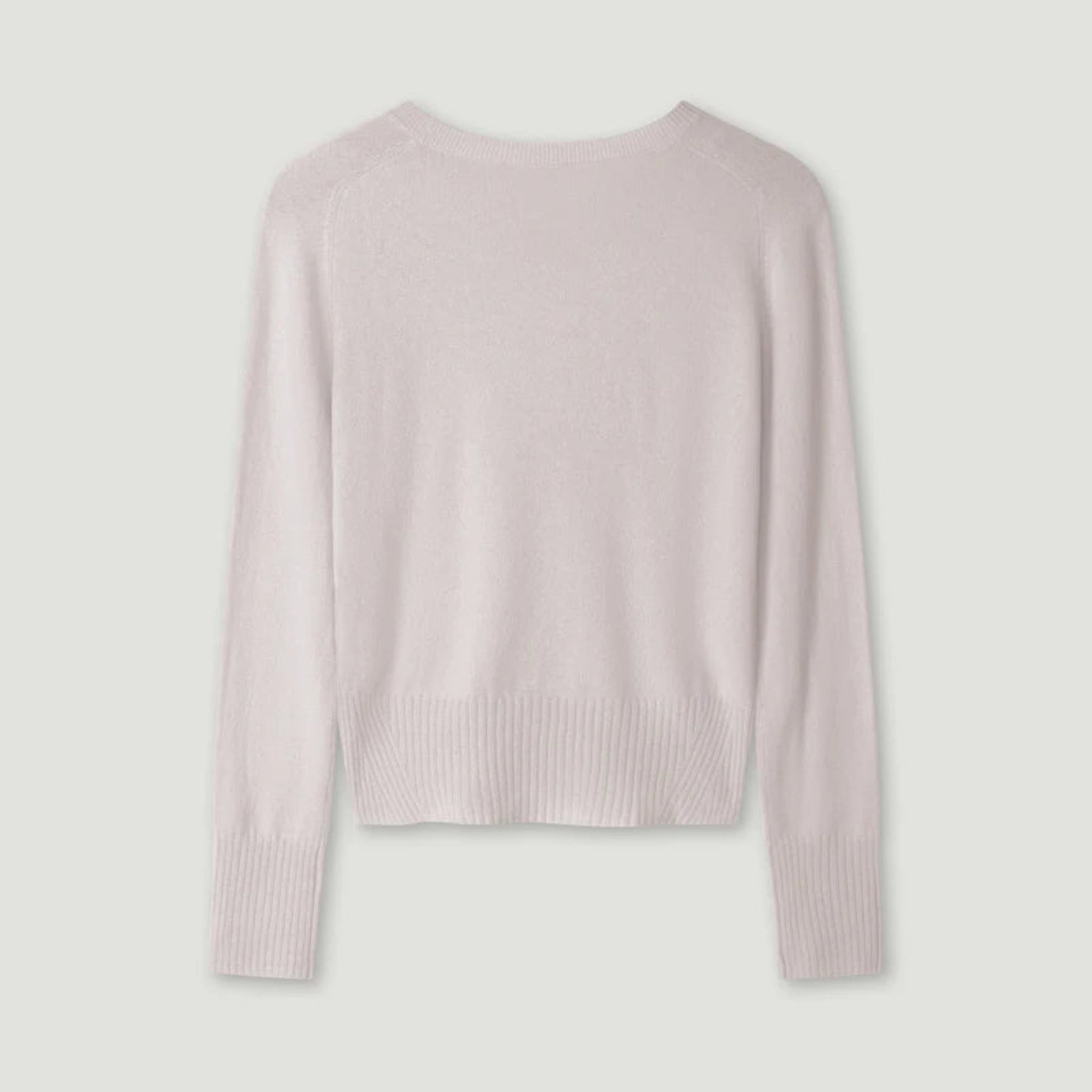 Light pink sweater on a light gray background