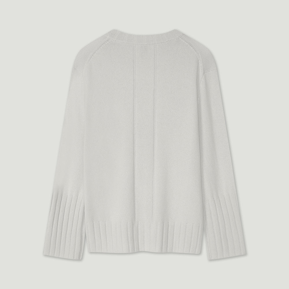 Light gray ribbed sweater on a light gray background