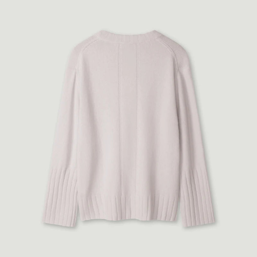 Light pink ribbed sweater on a light gray background
