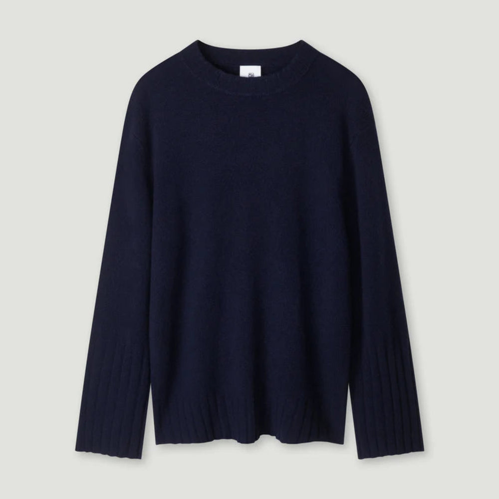 Navy blue sweater on a light gray background