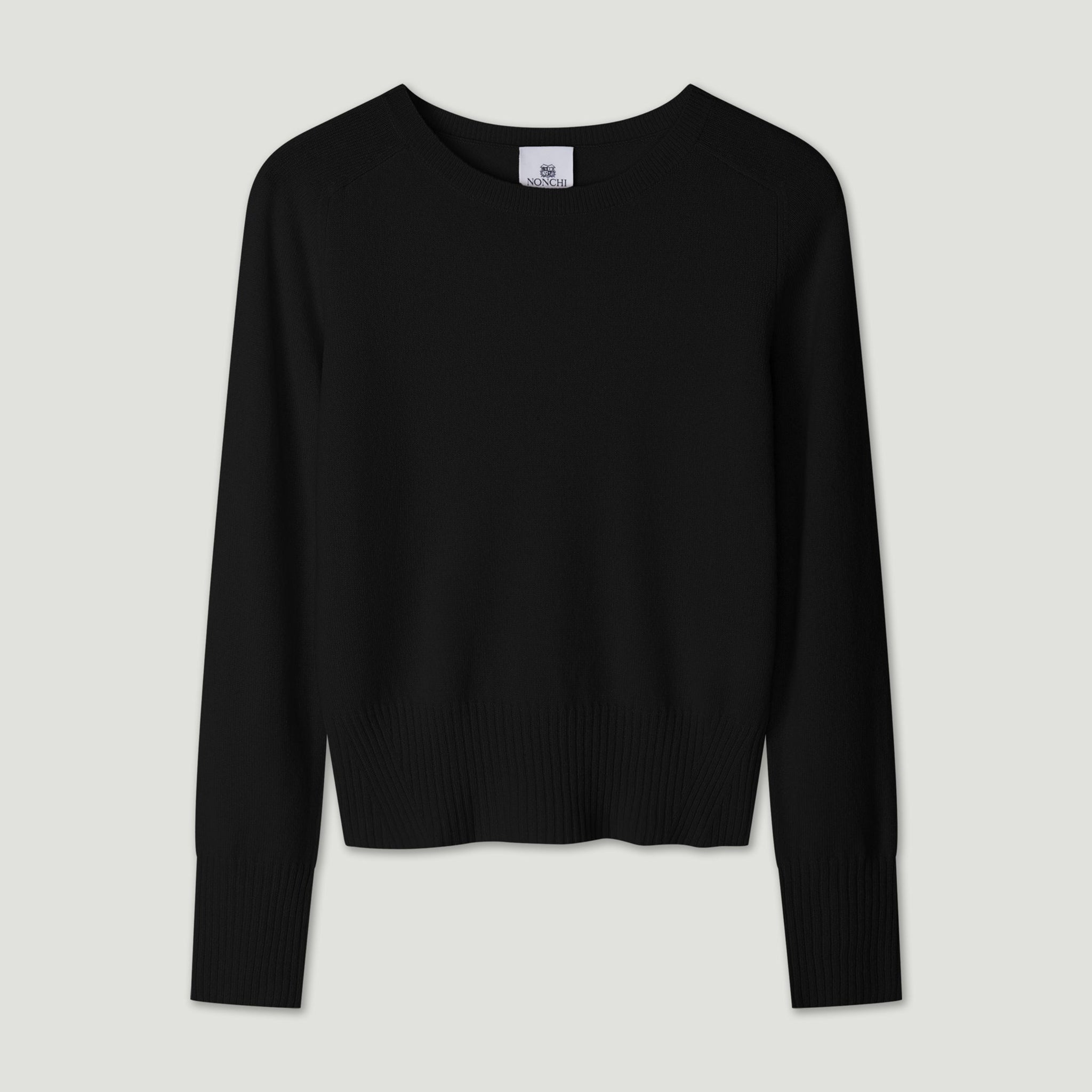 Black sweater on a light gray background 