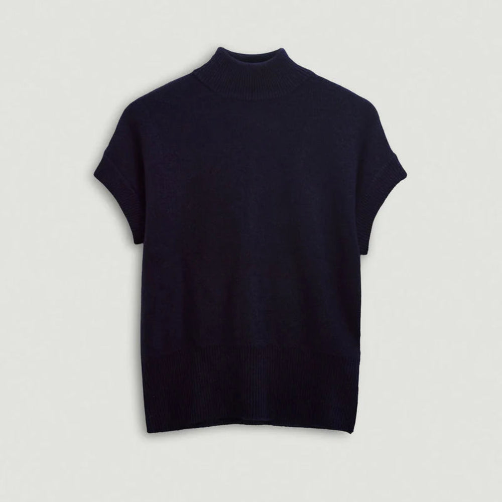 Navy turtleneck sweater on a light gray background