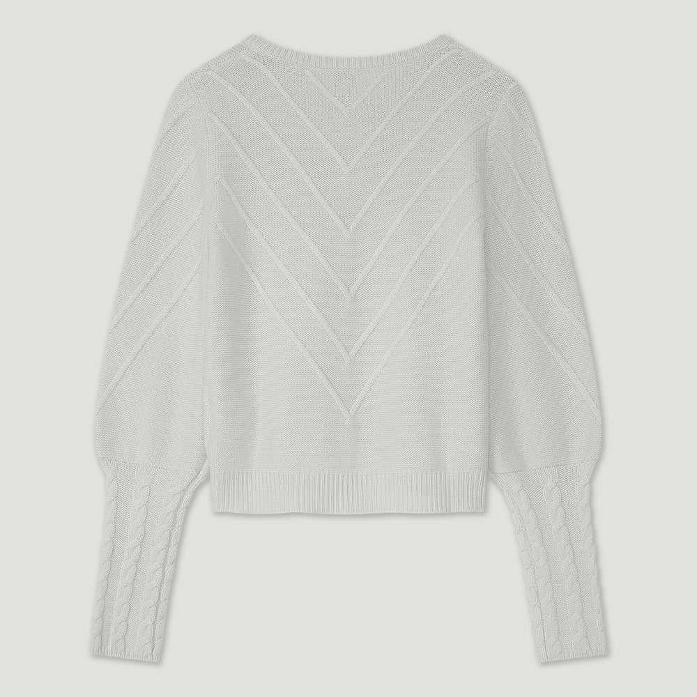 Light gray sweater with a textured pattern on a light gray background