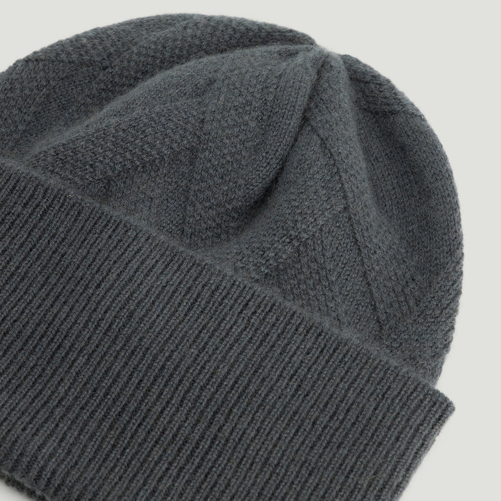 Gray knit beanie on a light gray background