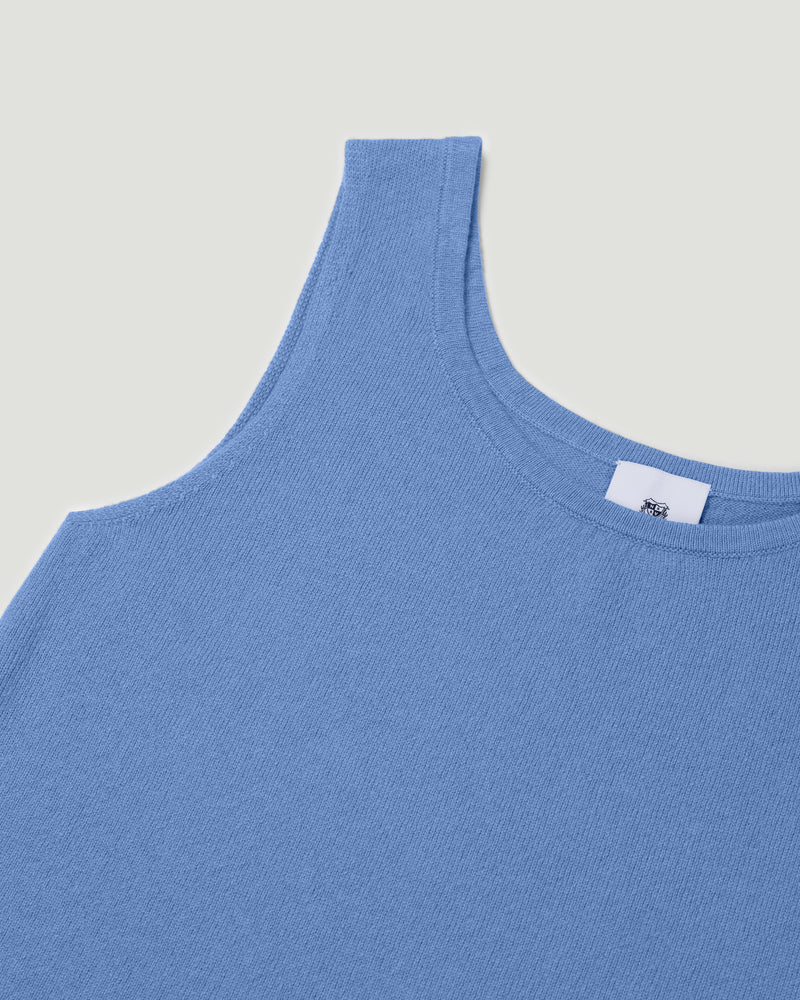 Blue tank top with a brand label on a light gray background